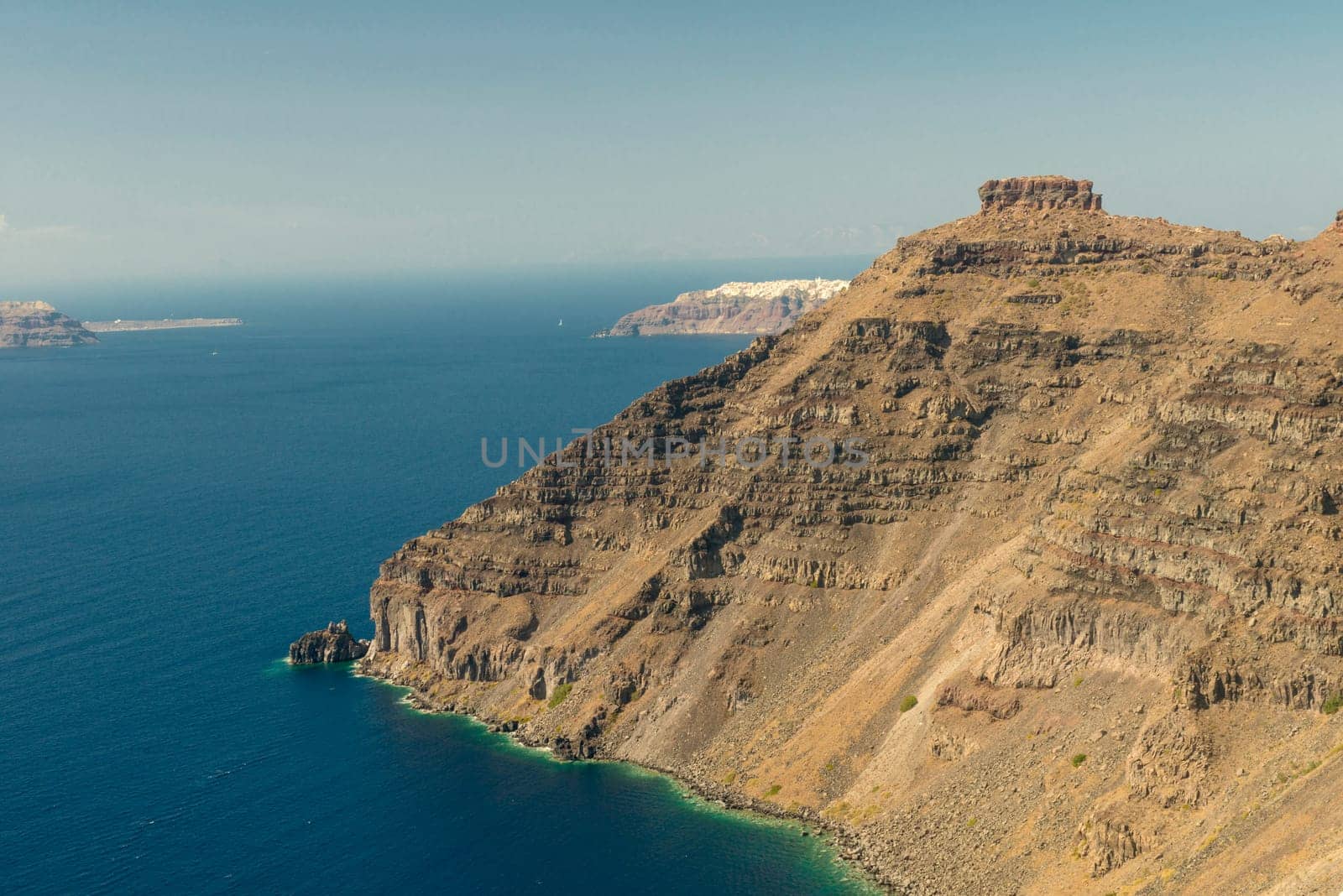 View on rock coastline on Santorini island, Greece.