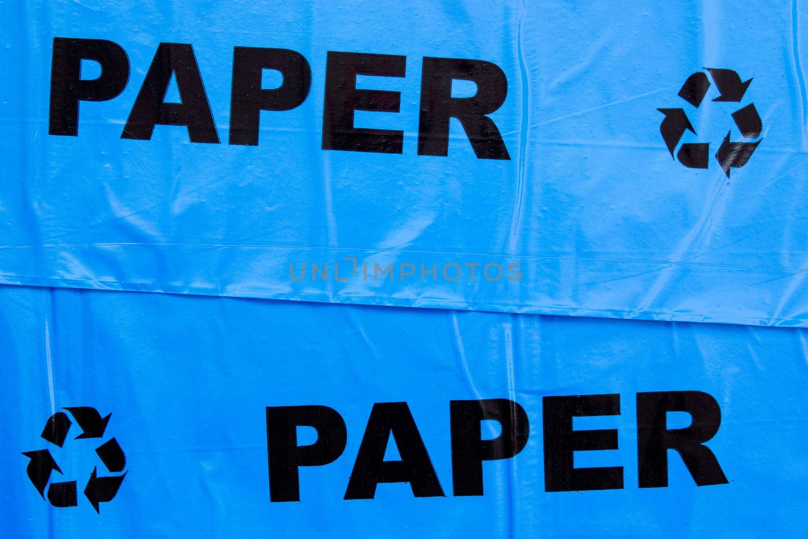 Background of yellow garbage bags for recyclable paper