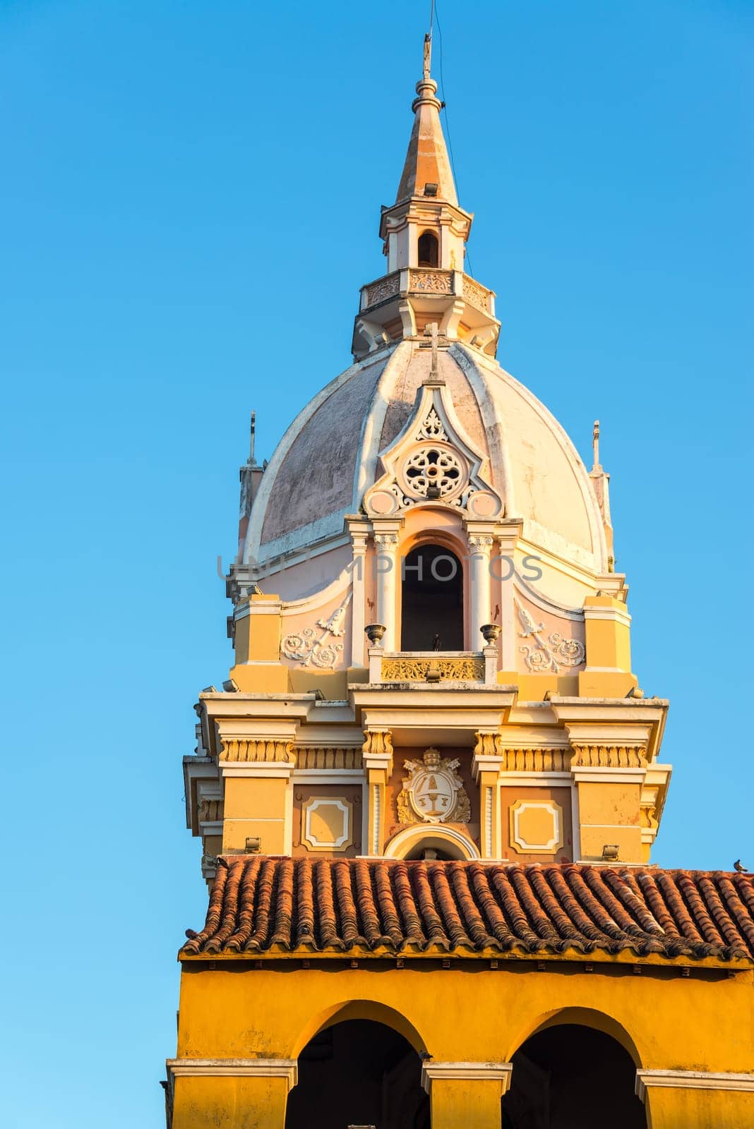 Tower of the the cathedral in Cartagena, Colombia bathed in golden early morning sunlight