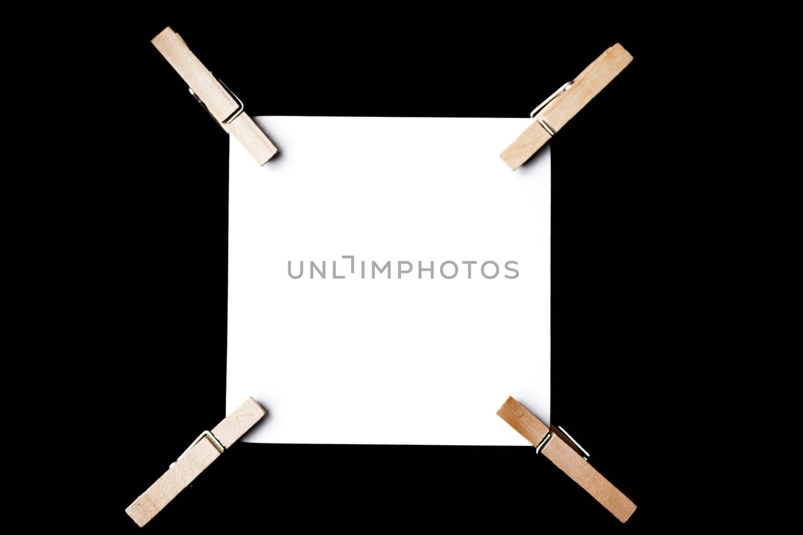 A reminder note pinned with a wooden peg on the side.