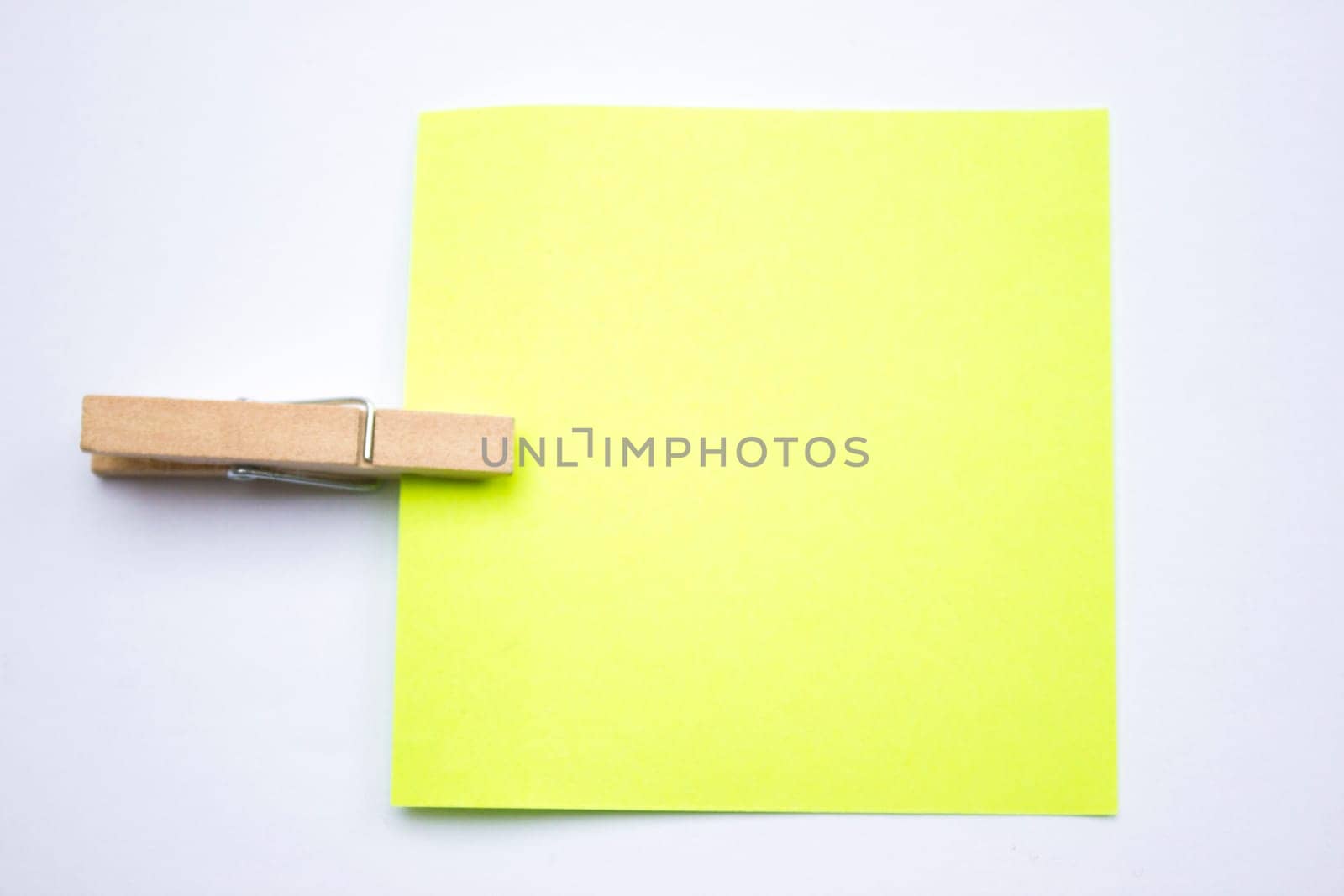 A reminder note pinned with a wooden peg on the side.