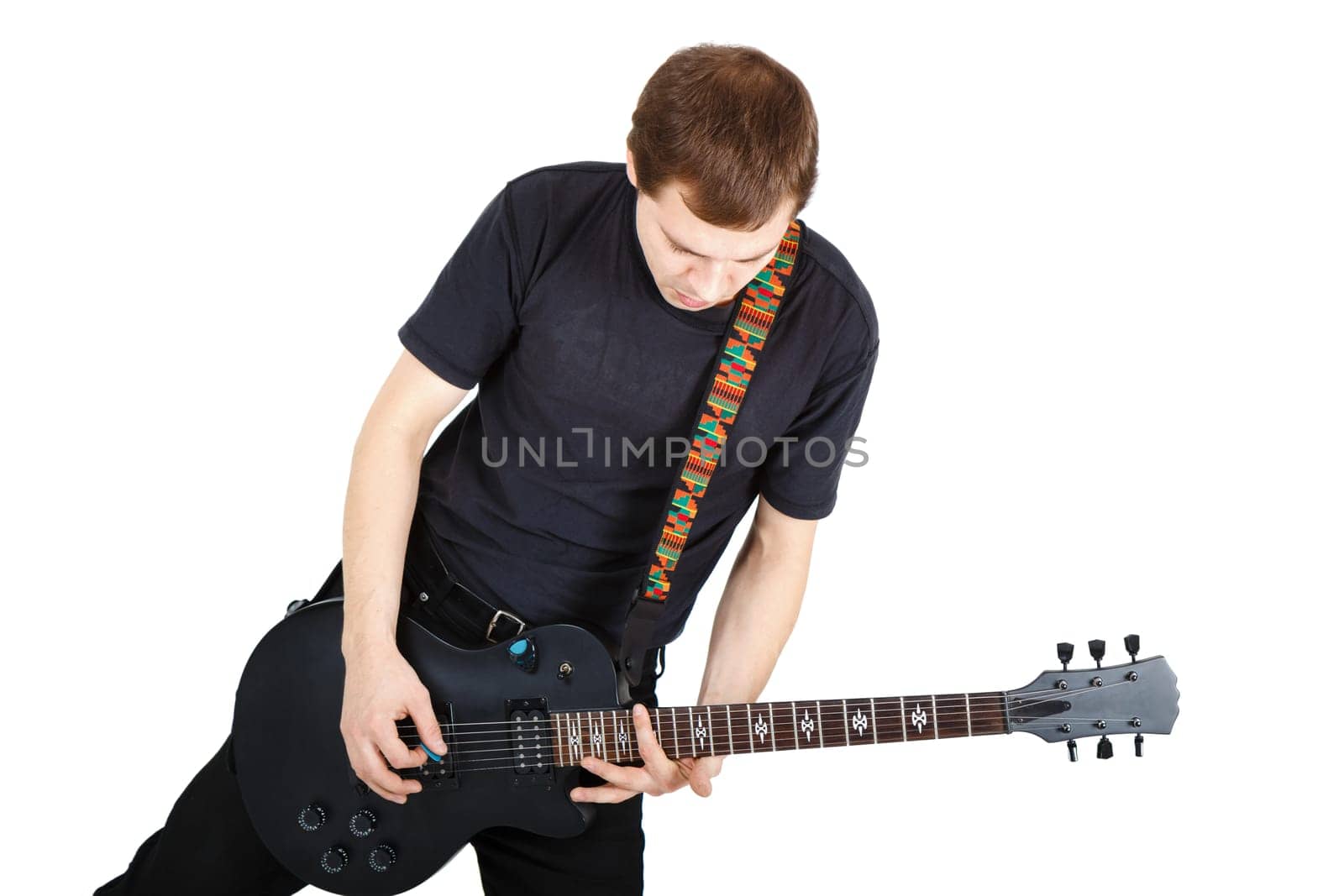 Man in black clothes with an electric guitar
