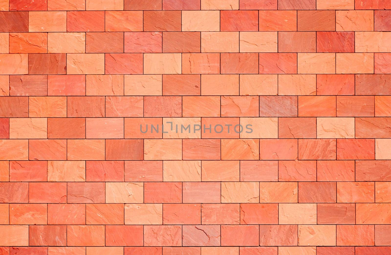 Surface of a terracotta colored wall.