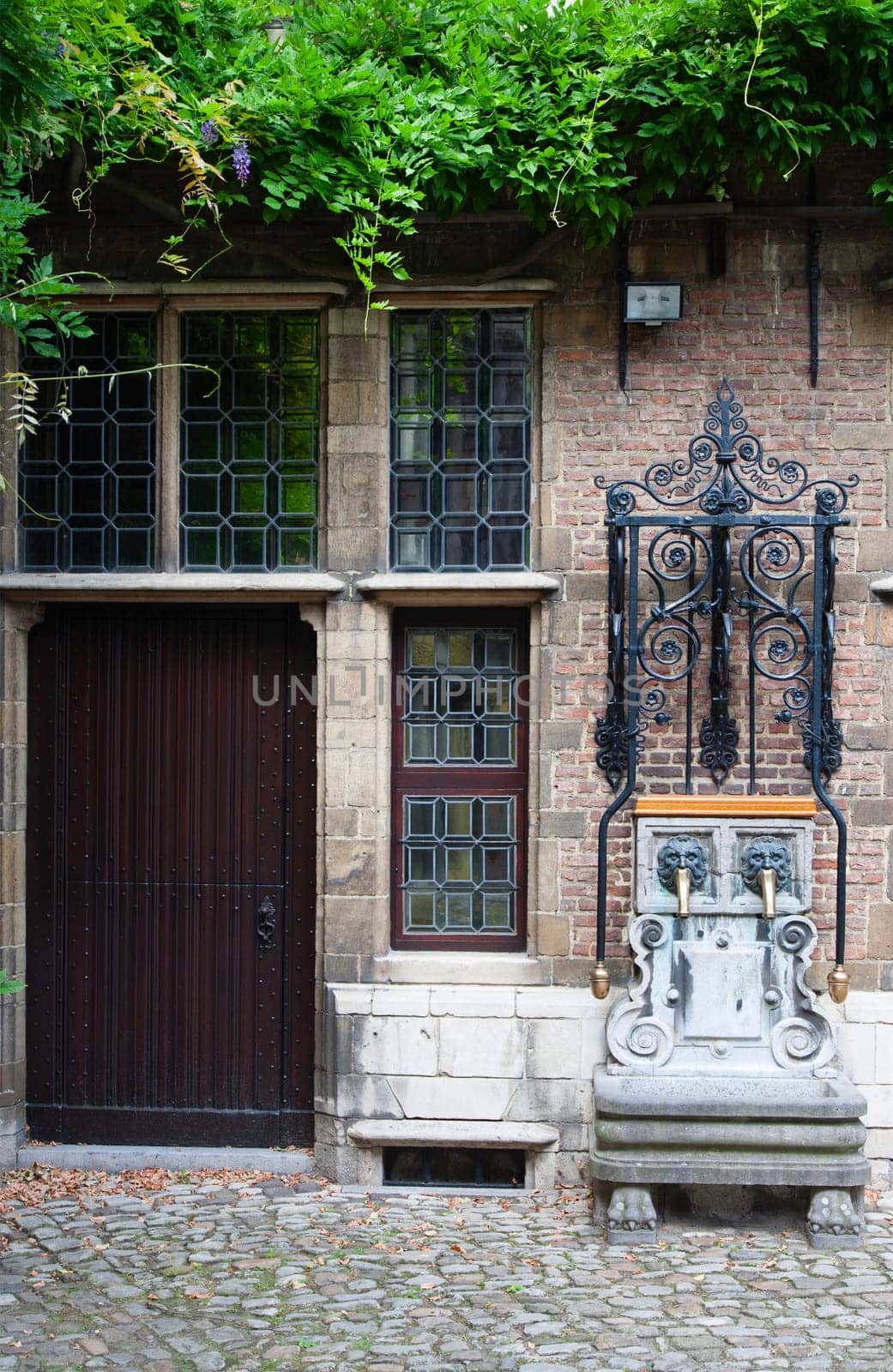 Water pump at the courtyard of the Rubenshouse, the former home and studio of Peter Paul Rubens in Antwerp, Belgium.