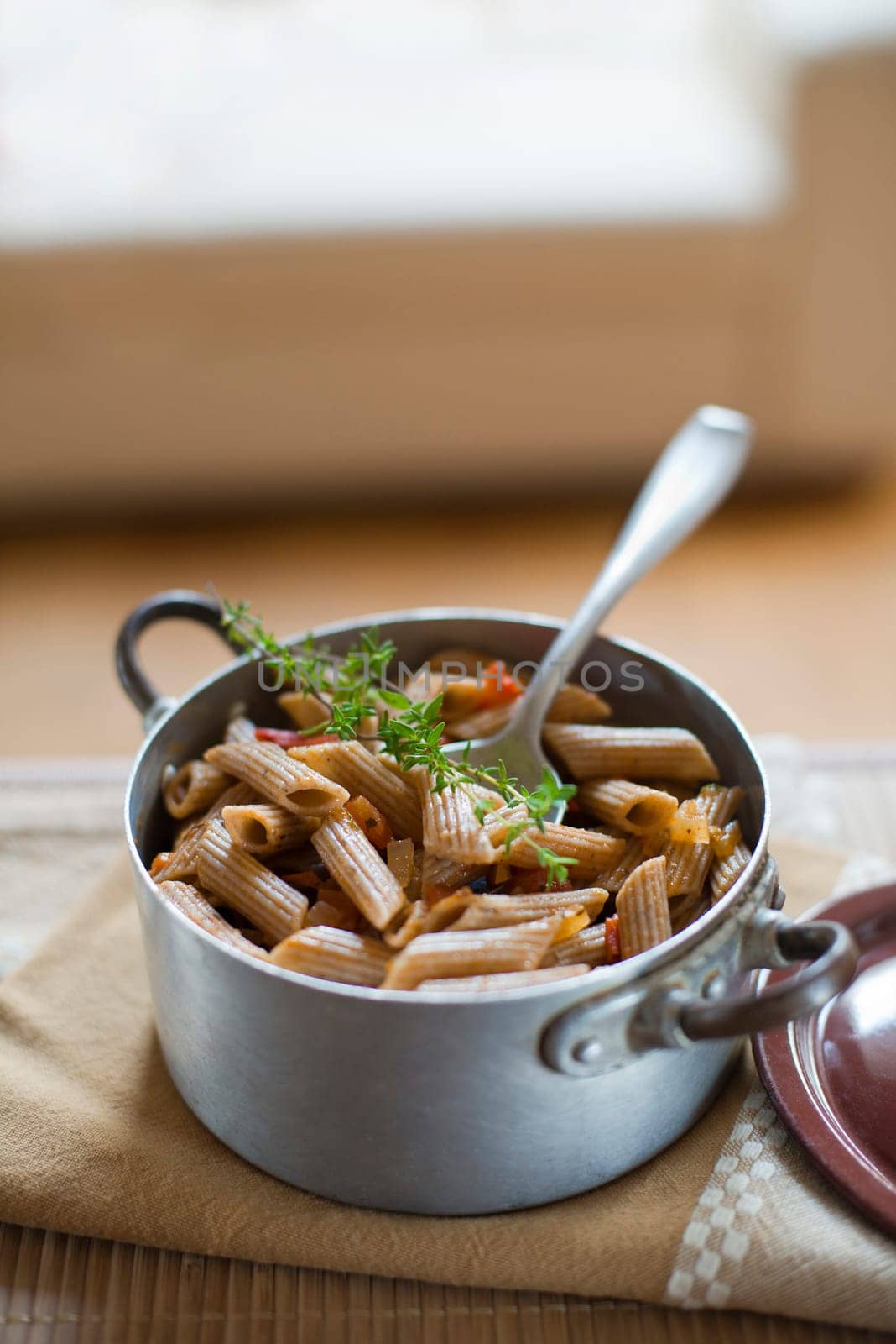 Whole grain pasta with tomato sauce close up shoot