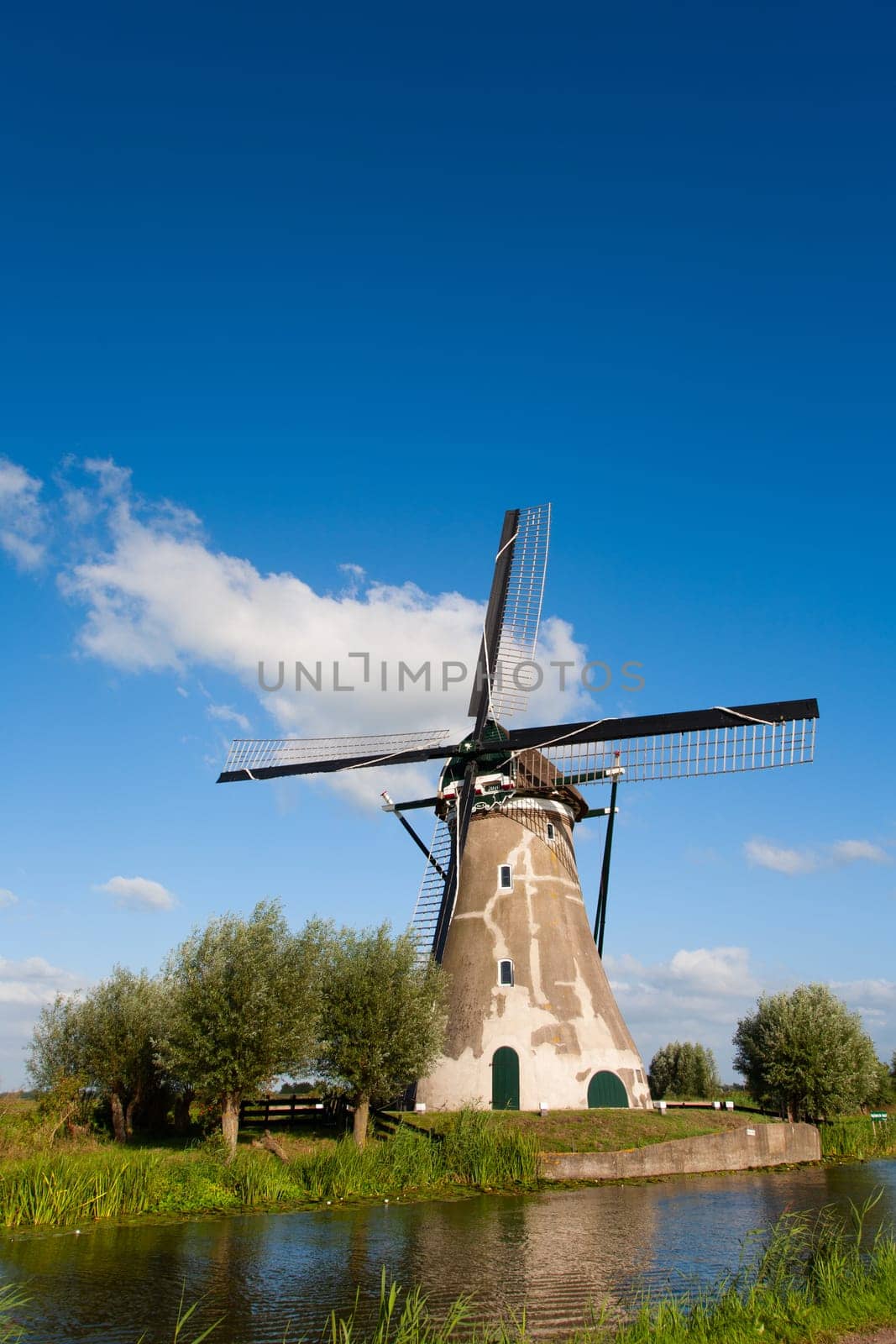 Dutch windmill at the river Vlist in the Netherlands.