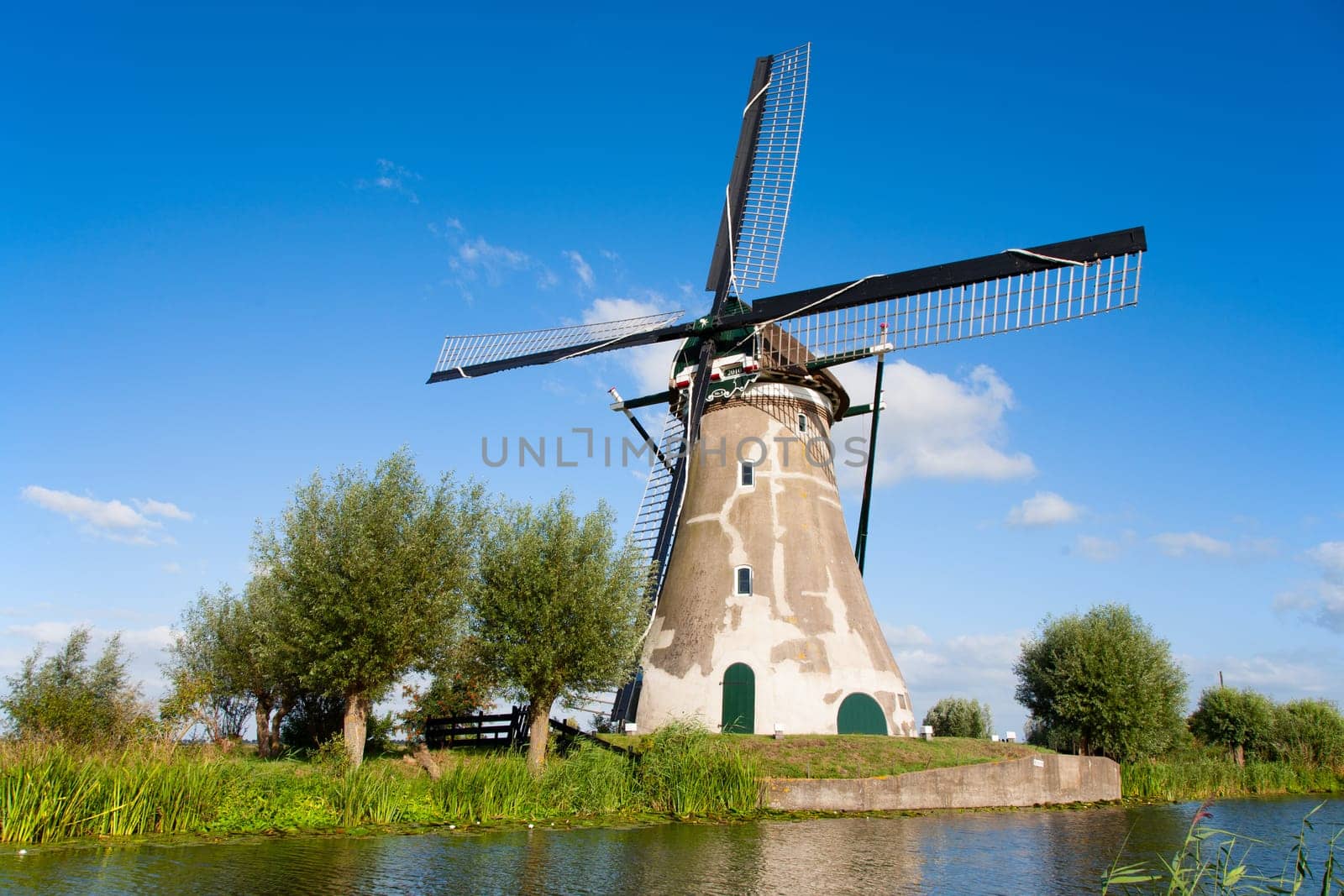 Dutch windmill at the river Vlist in the Netherlands.