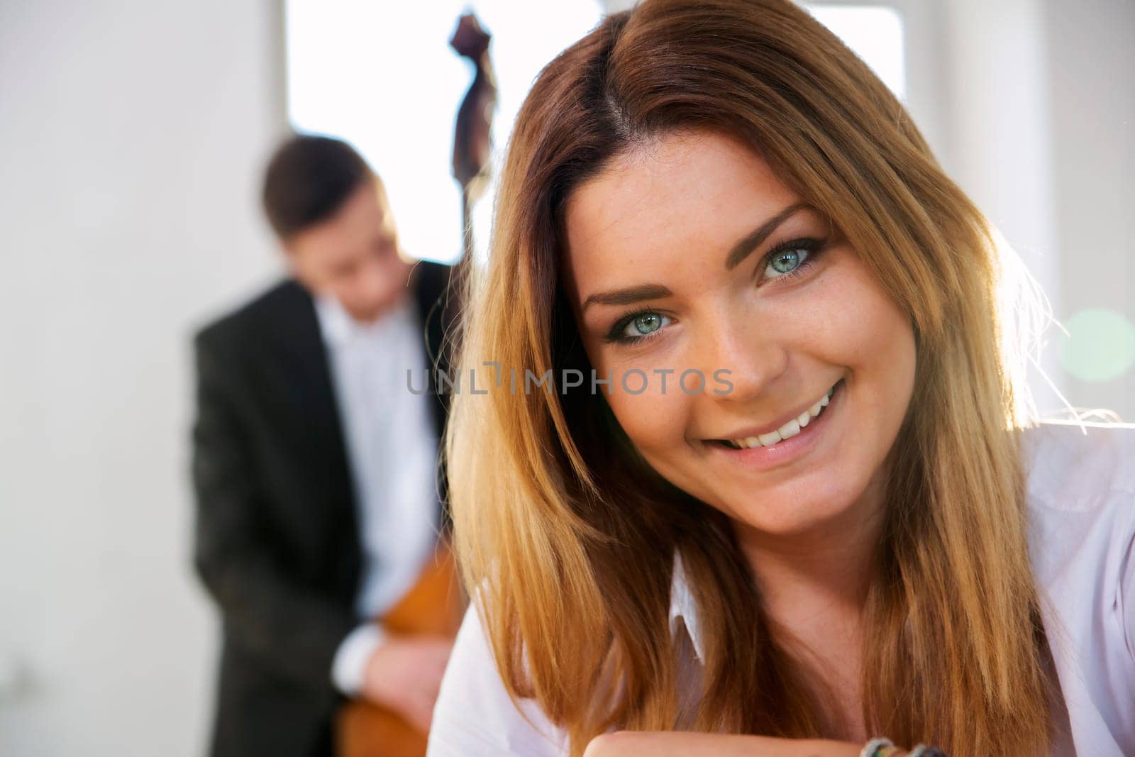 Zoomed face of young woman smile on camera
