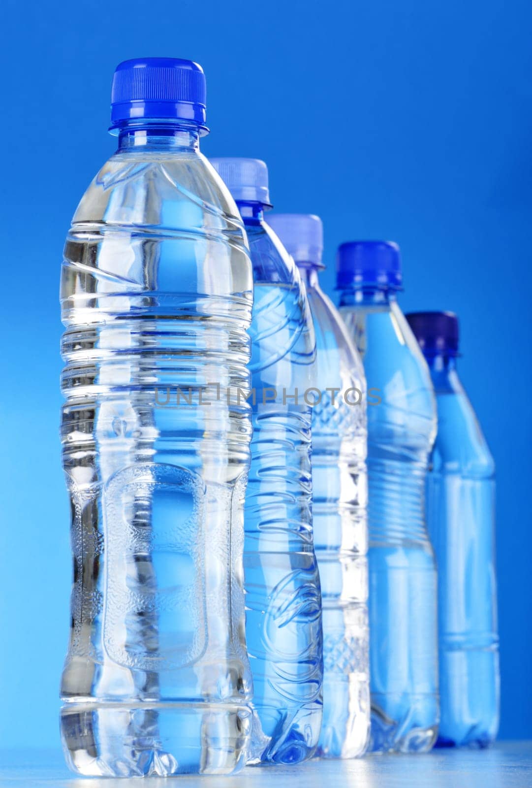 Composition with assorted plastic bottles of mineral water