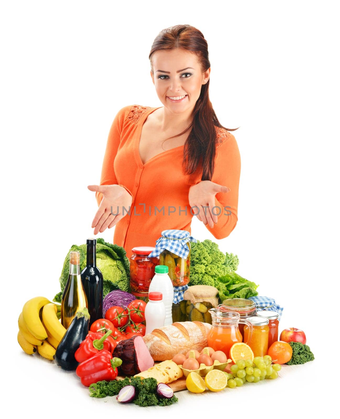 Young woman with assorted grocery products isolated on white background