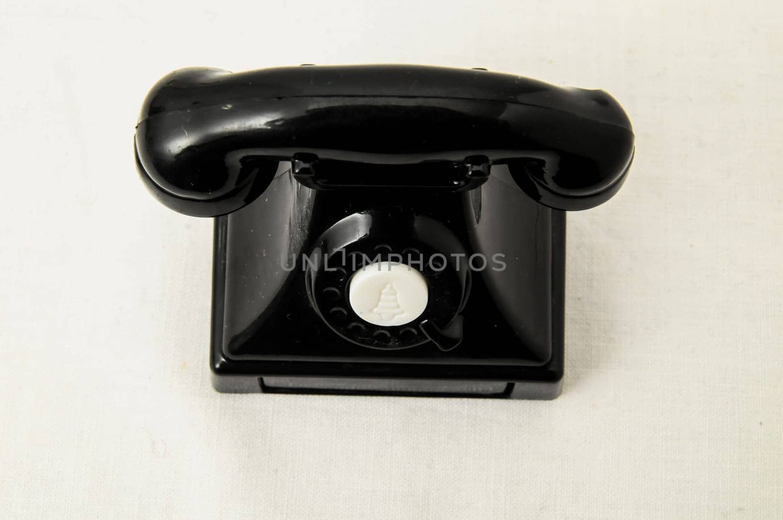 Vintage Old Telephone Plastic Black Toy on a White Background