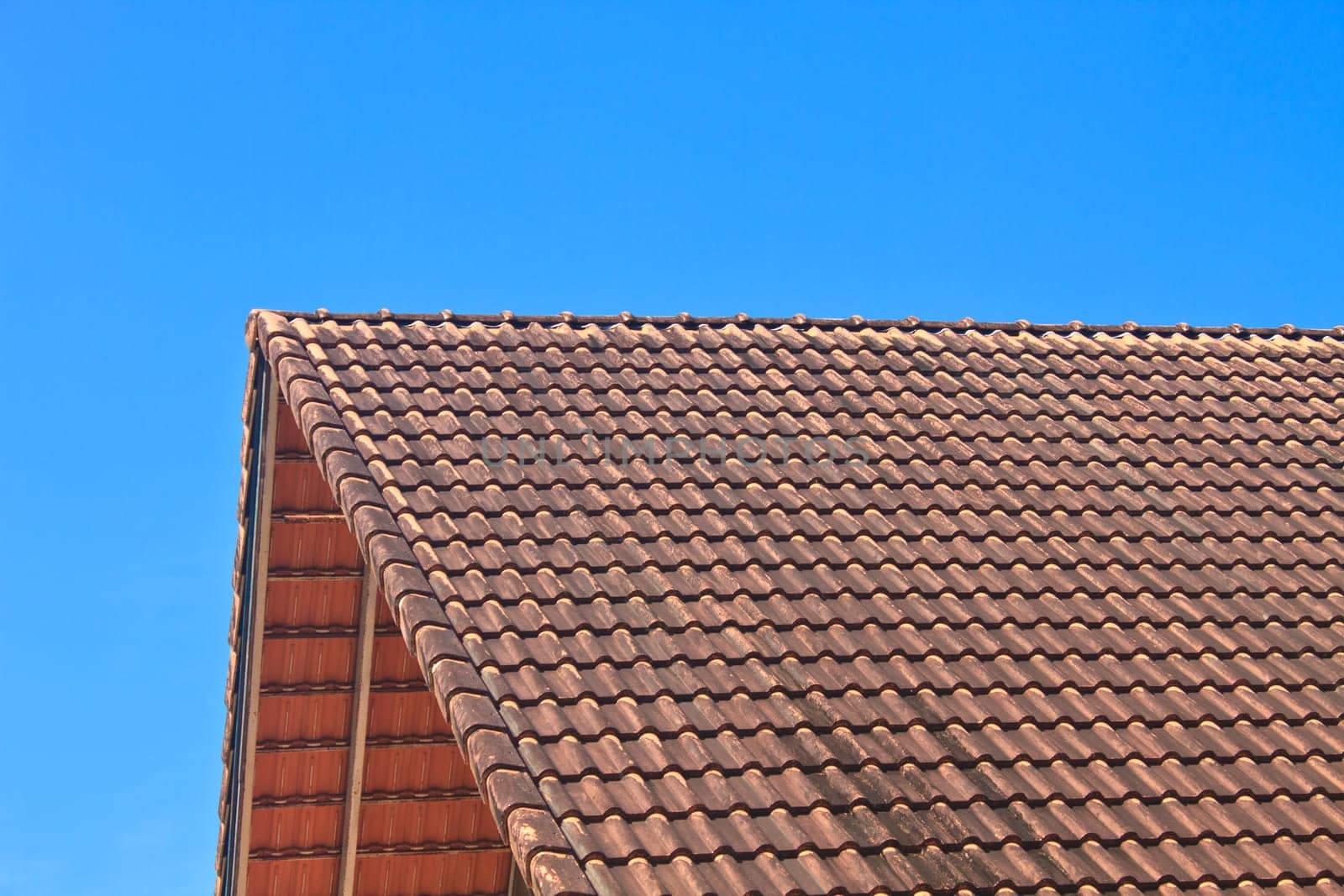 roof tile pattern over blue sky