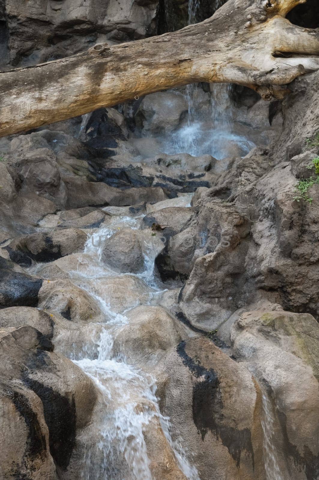 Small River Waterfall Between some Brown Rocks