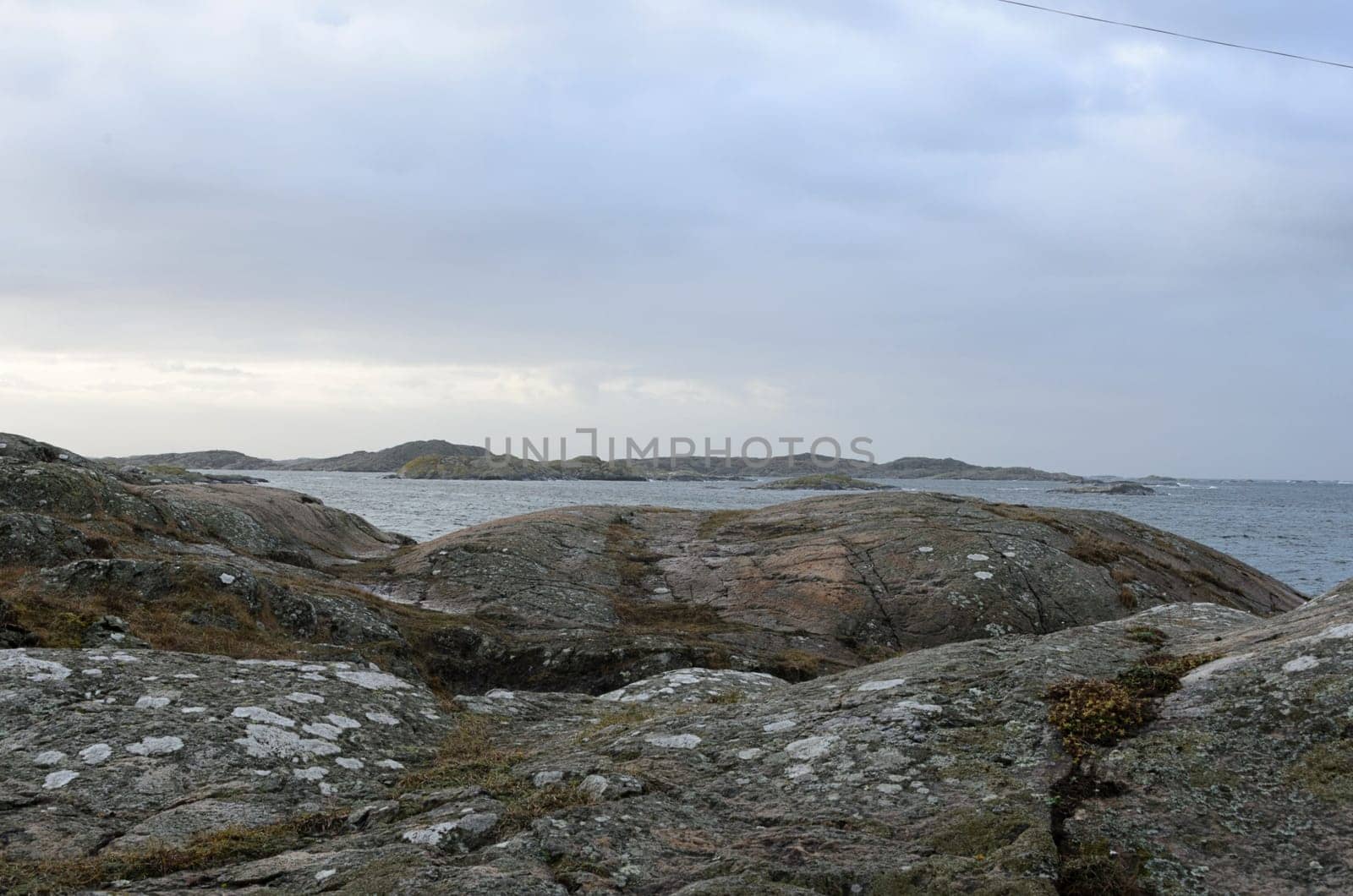 rocks by the sea on a windy and rainy day