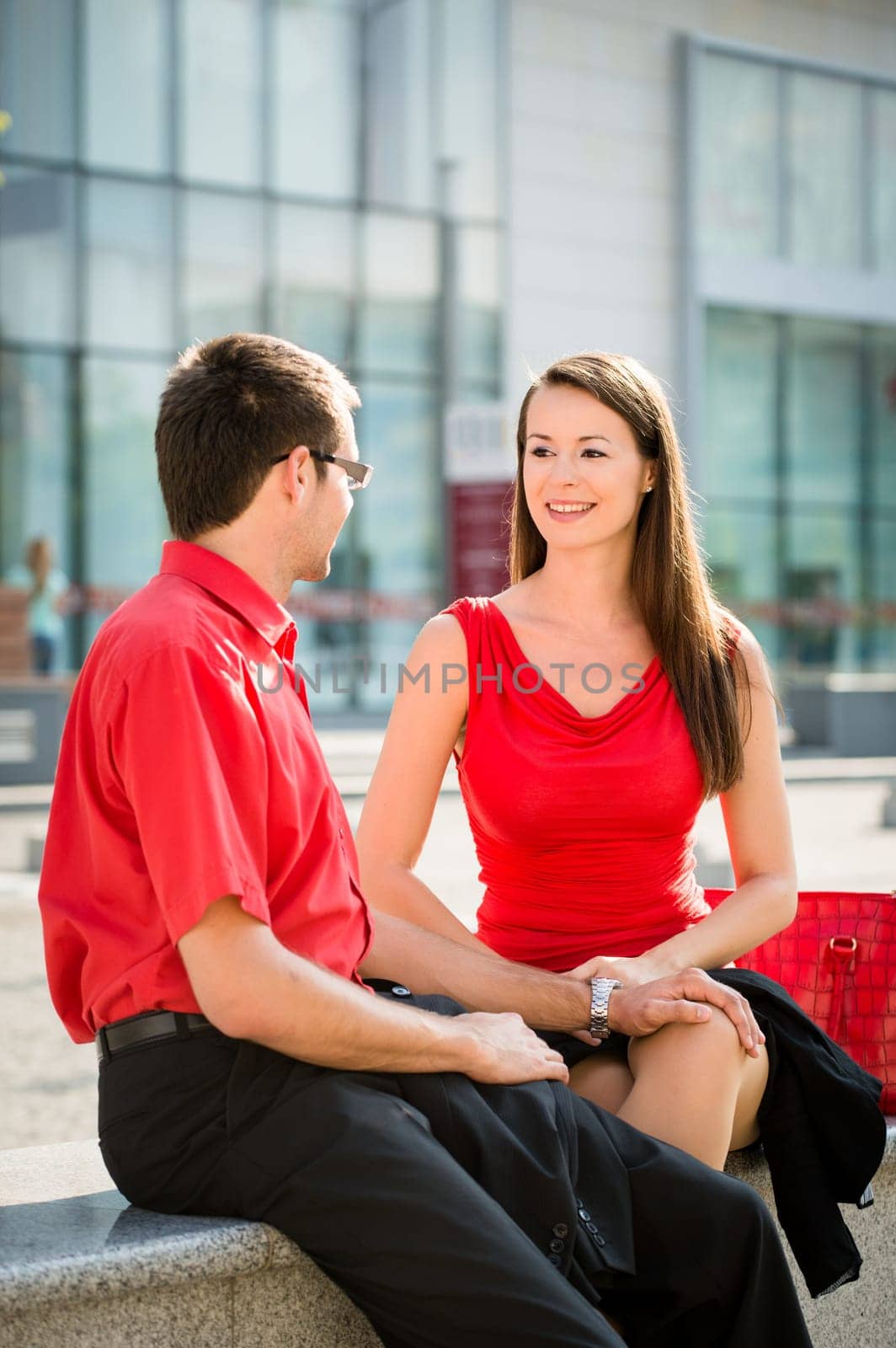 Colleagues - young business people having conversation outdoor in street