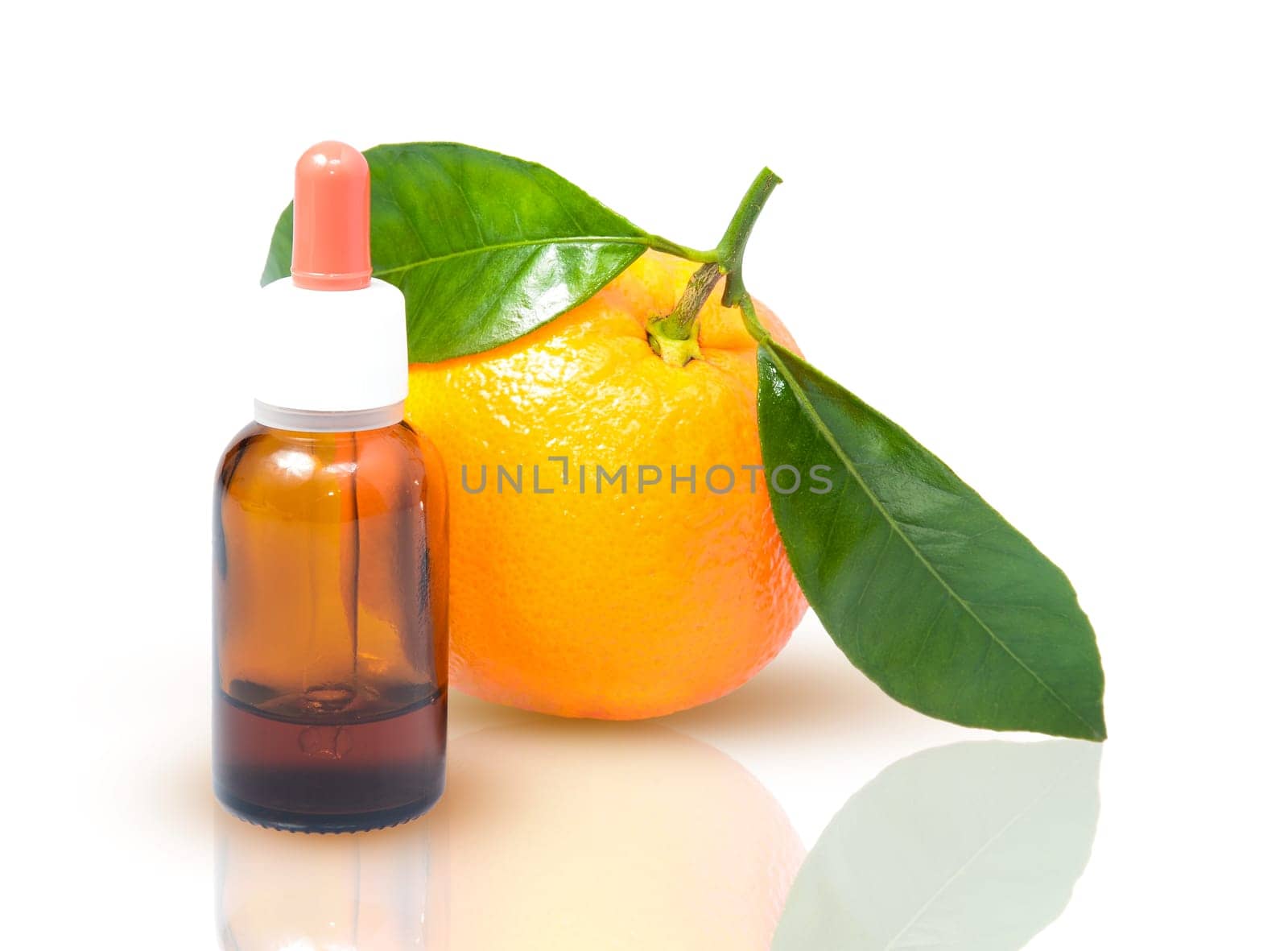 Orange with green leaves and a bottle with dropper isolated on a white background. Alternative medicine concept