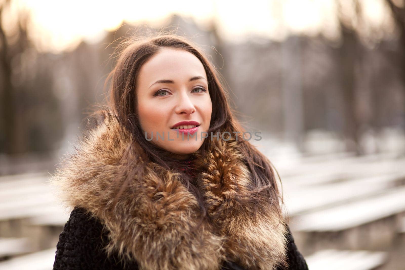 Happy and healthy smiling woman during the autumn in the park