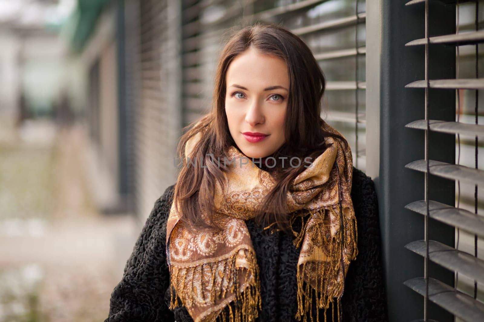 Business woman is walking in the park during her business lunch