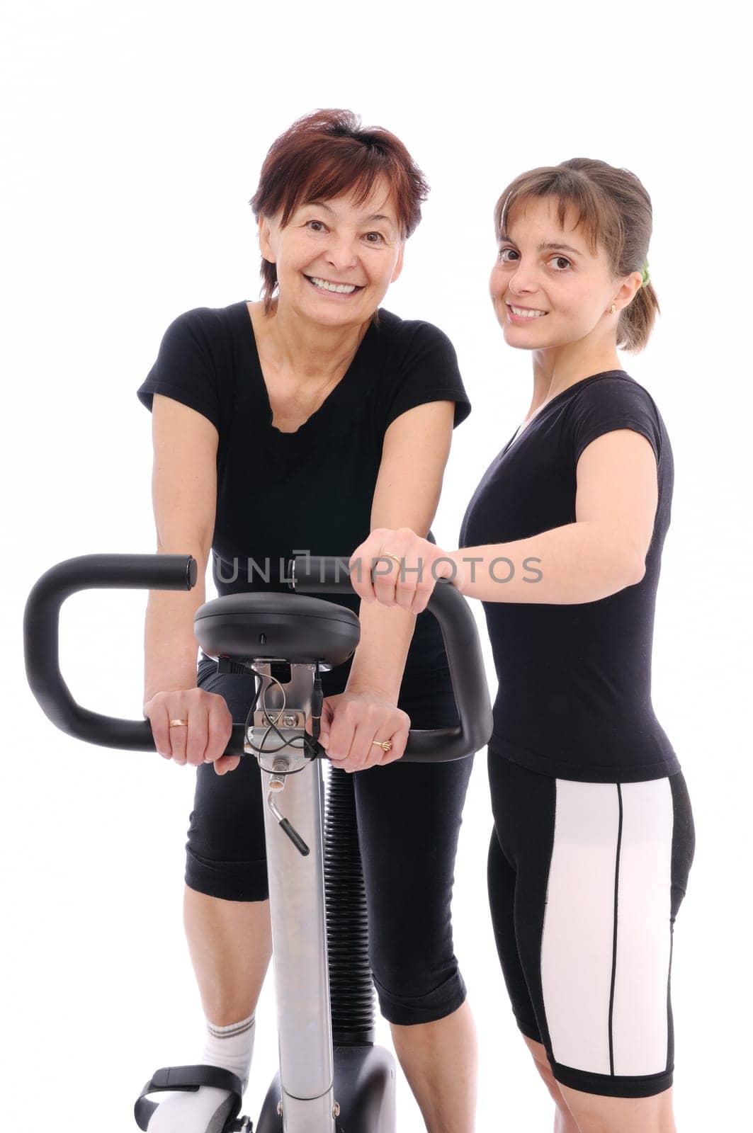 Spinning senior woman with coach