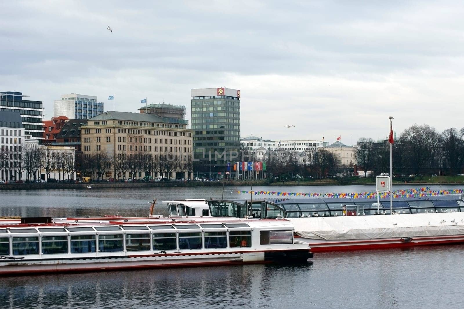 Hamburg,Germany – January 02,2014: Two excursion boats are moored on the Alster in Hamburg's city centre on January 2,2014 in Hamburg.