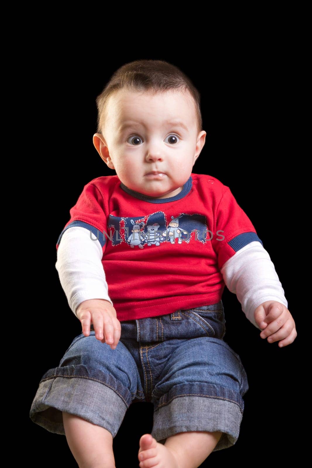 Baby boy on black background
