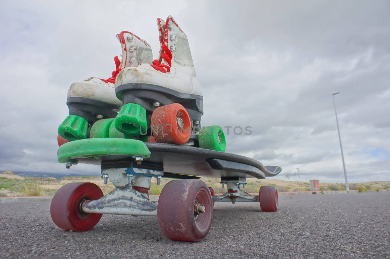 hdr picture of Vintage Style Longboard Black Skateboard on an Empty Asphalt Desert Road