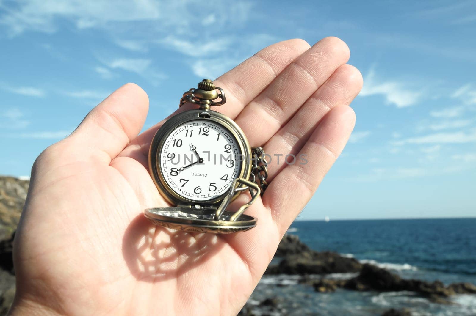 Time Concept Classic Vintage Pocket Clock on the Volcanic Rocks