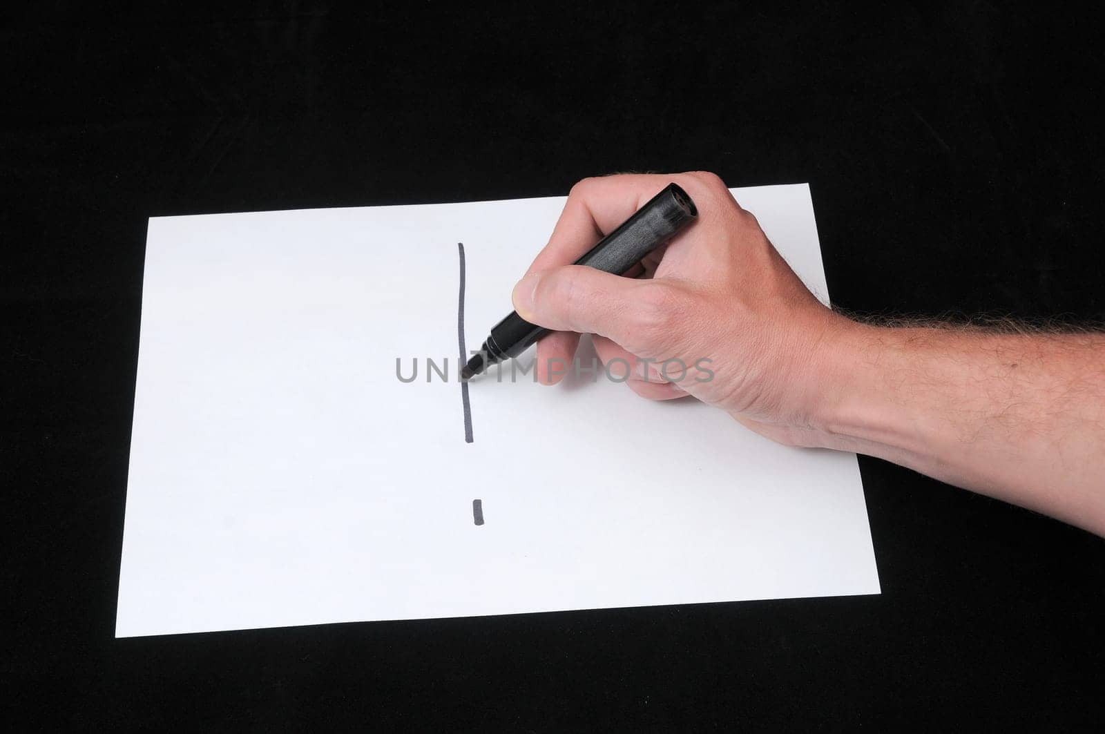 Caucasian Male Hand Drawing on a White Paper