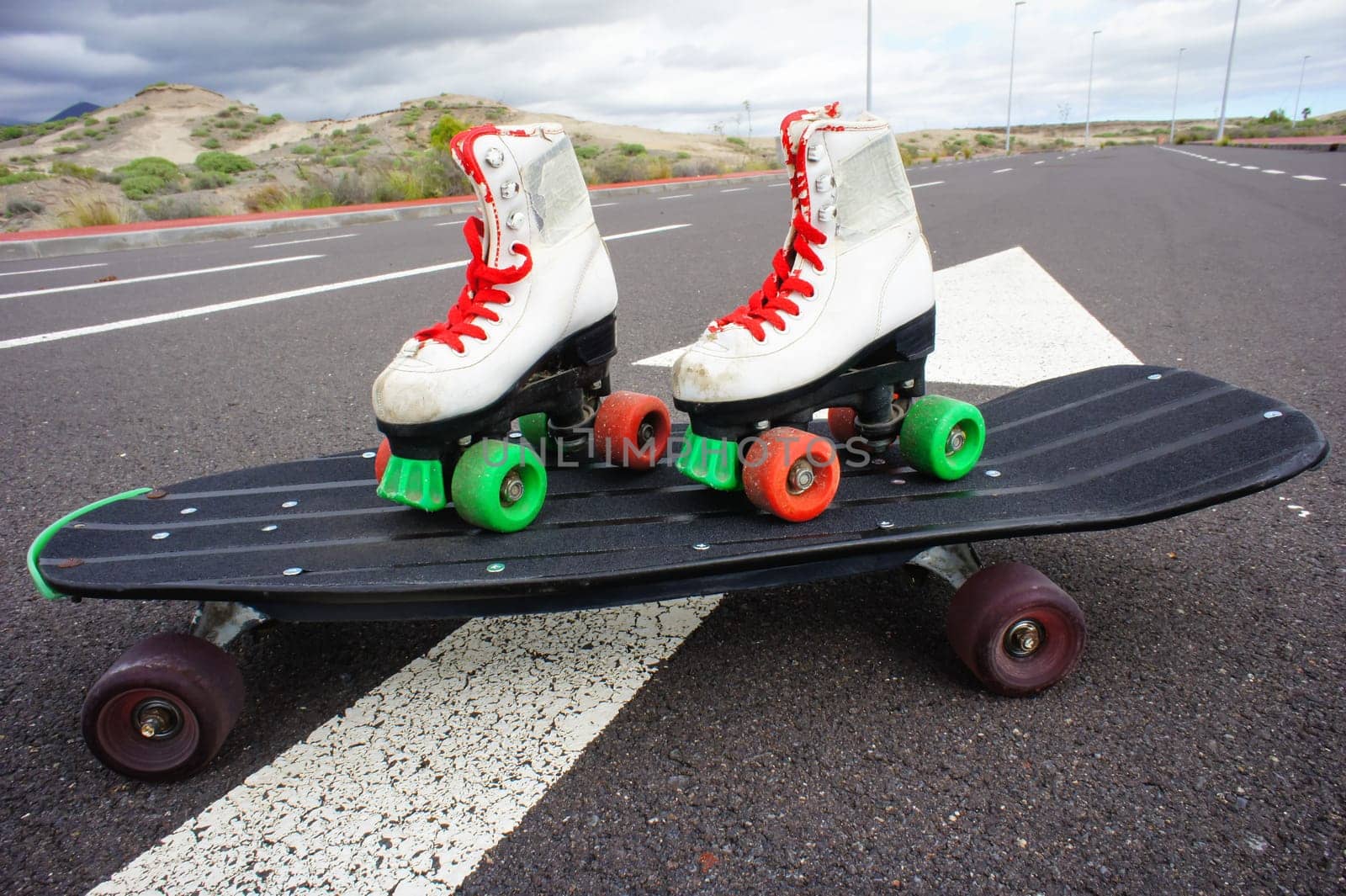 Old Vintage White Skate Boot on the Asphalt Sterret