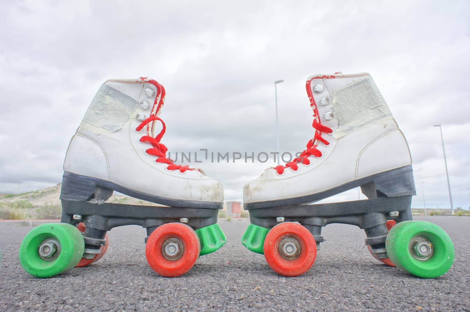 Hdr Picture of Old Vintage White Skate Boot on the Asphalt Sterret