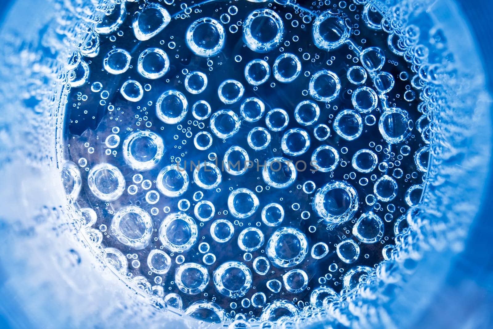 Blue transparent water splashes on white background