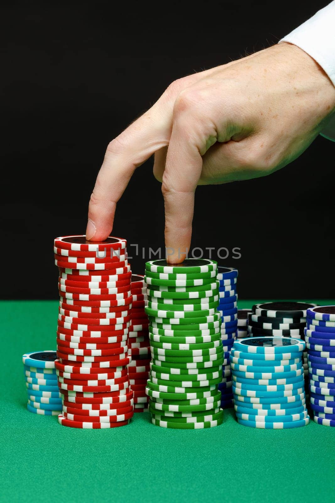 Hand walks on a pile of chips