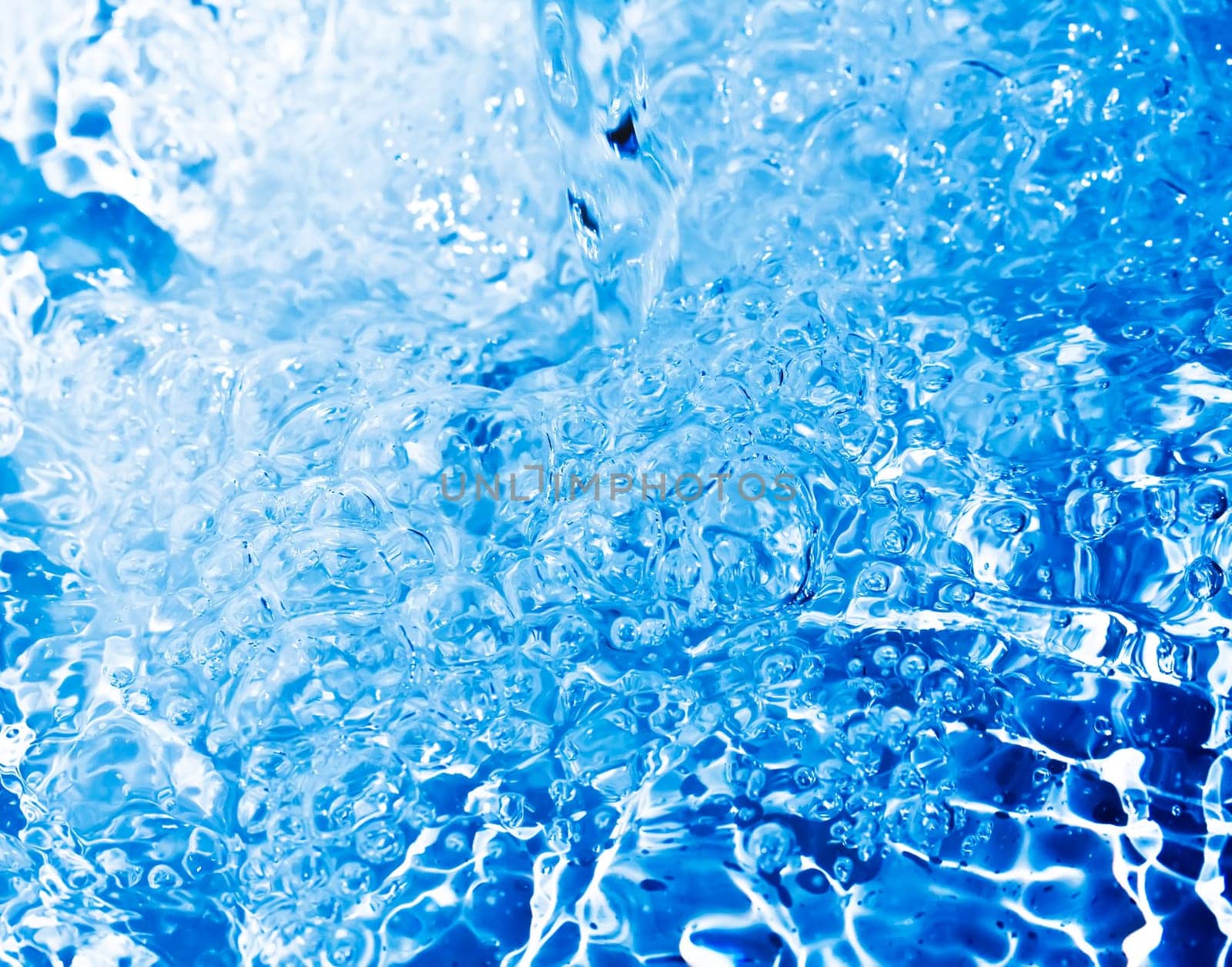 Blue transparent water splashes on white background