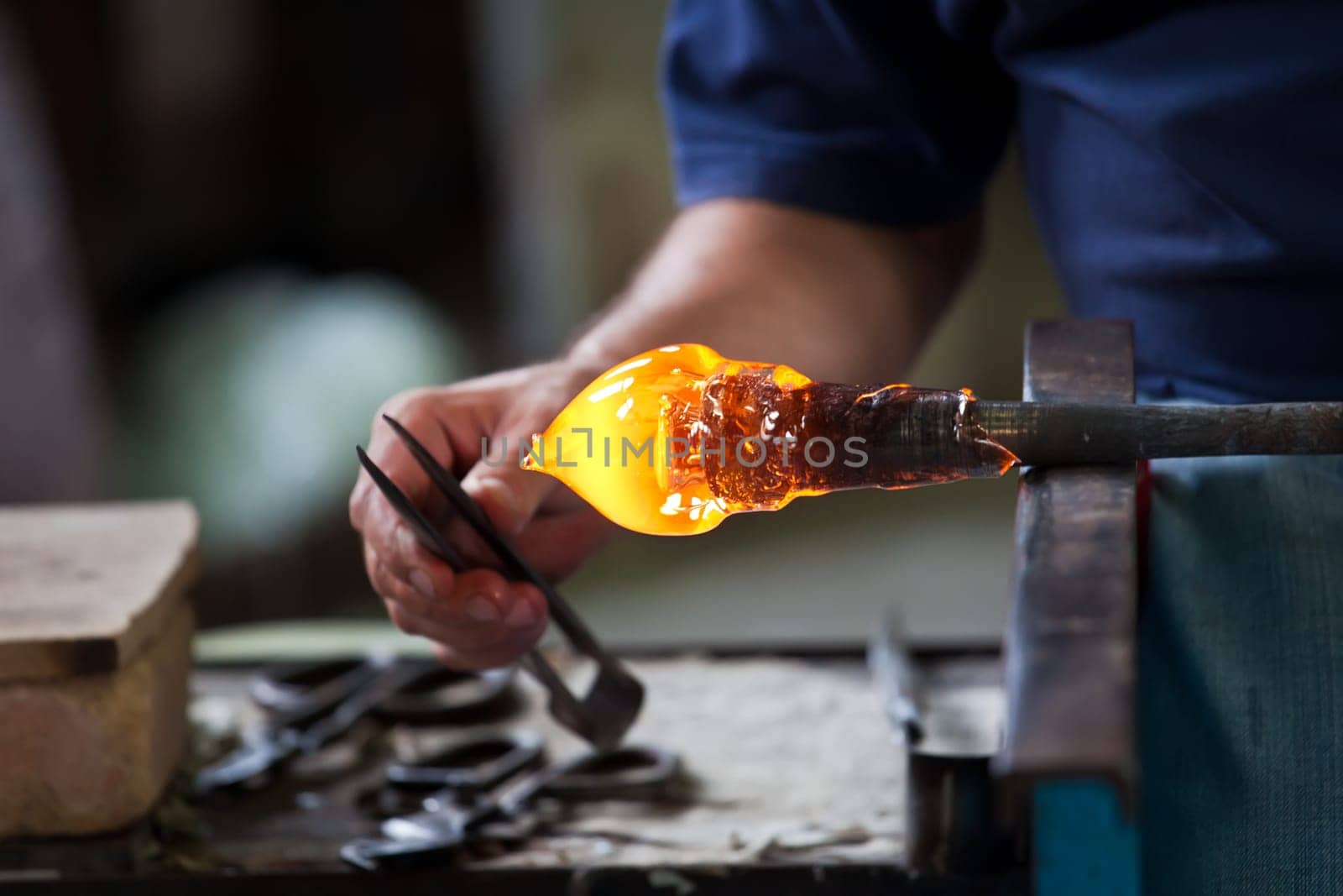 Glass blower forming beautiful piece of glass, Murano, Venice, Italy