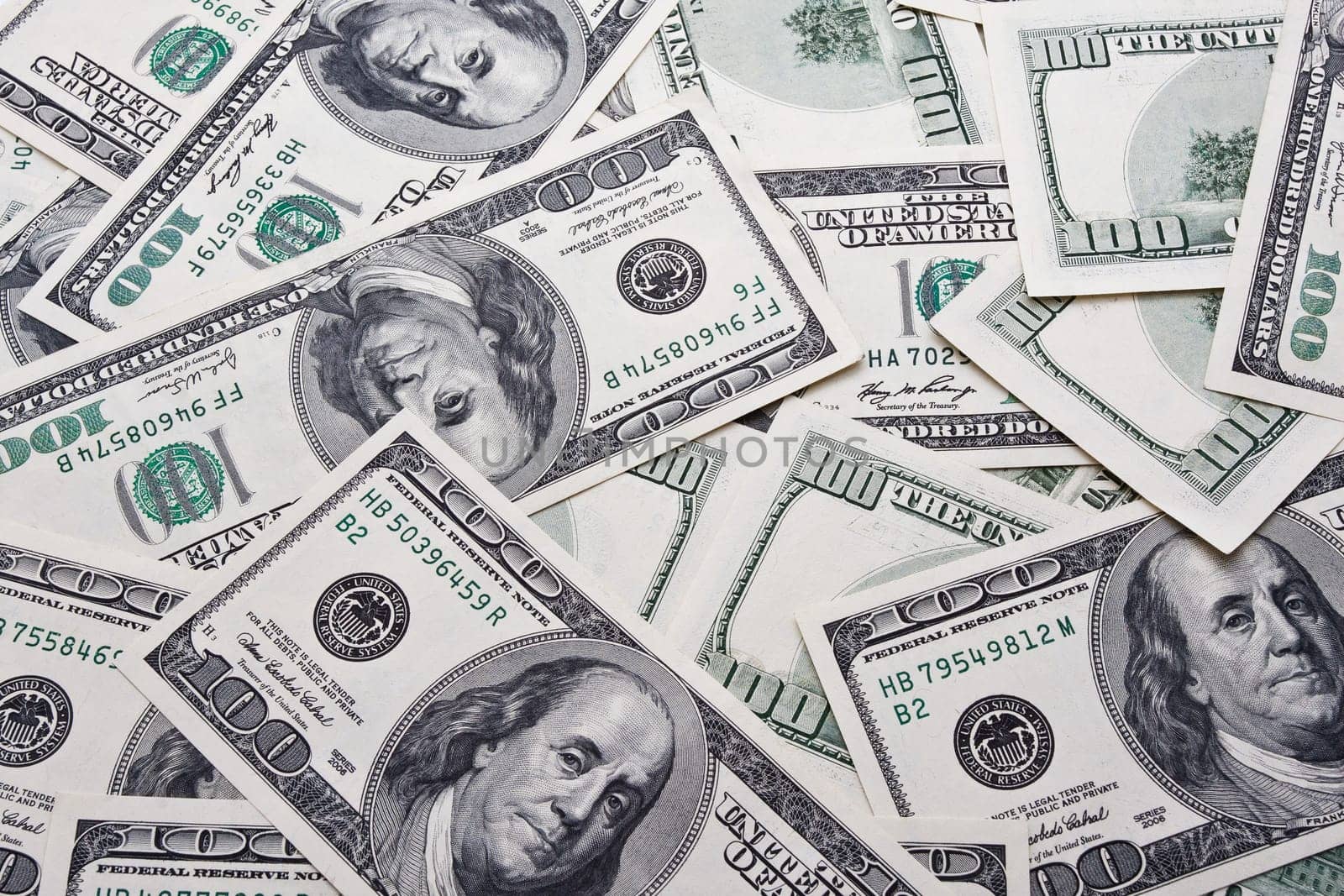 Lots of dollar notes arranged in chaotic manner, background