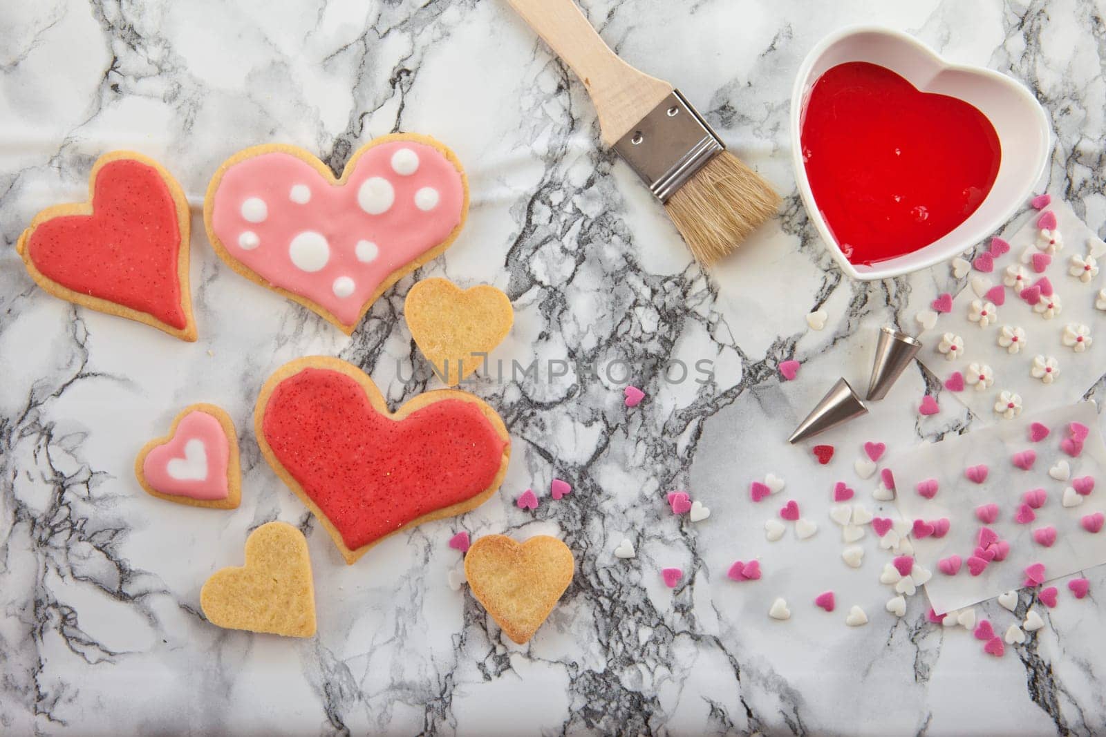 Heart-shaped colorful cookies decorate with frosting and décor
