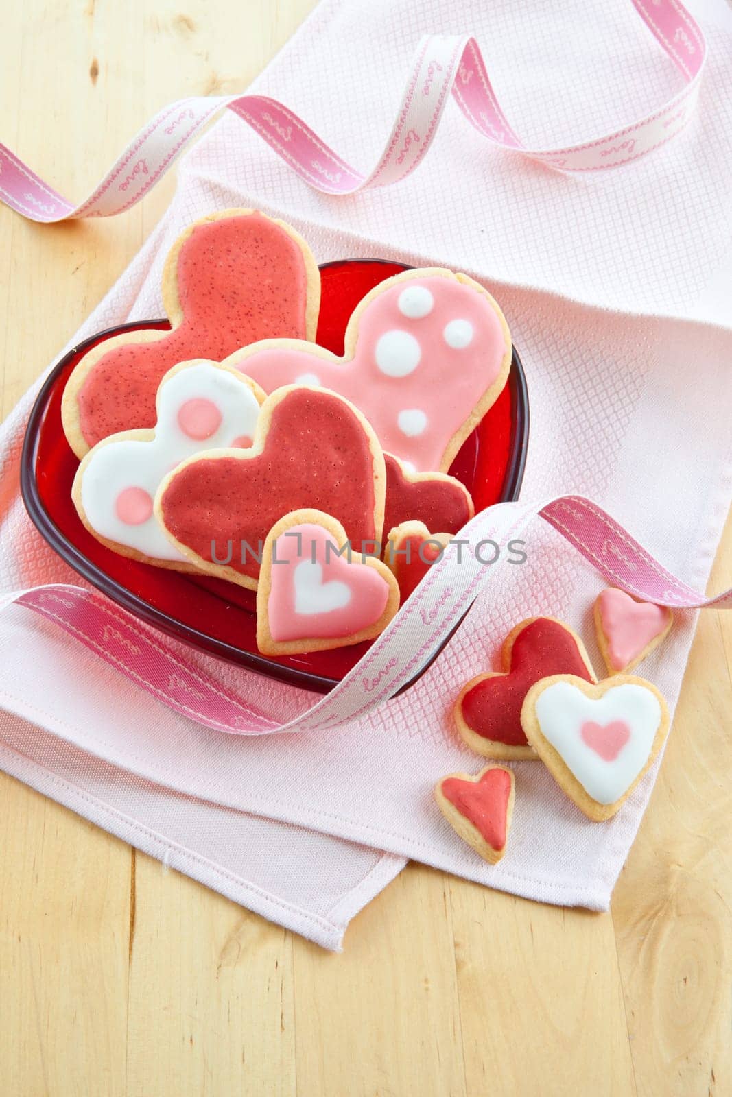 Red plate with colorful heart-shaped places