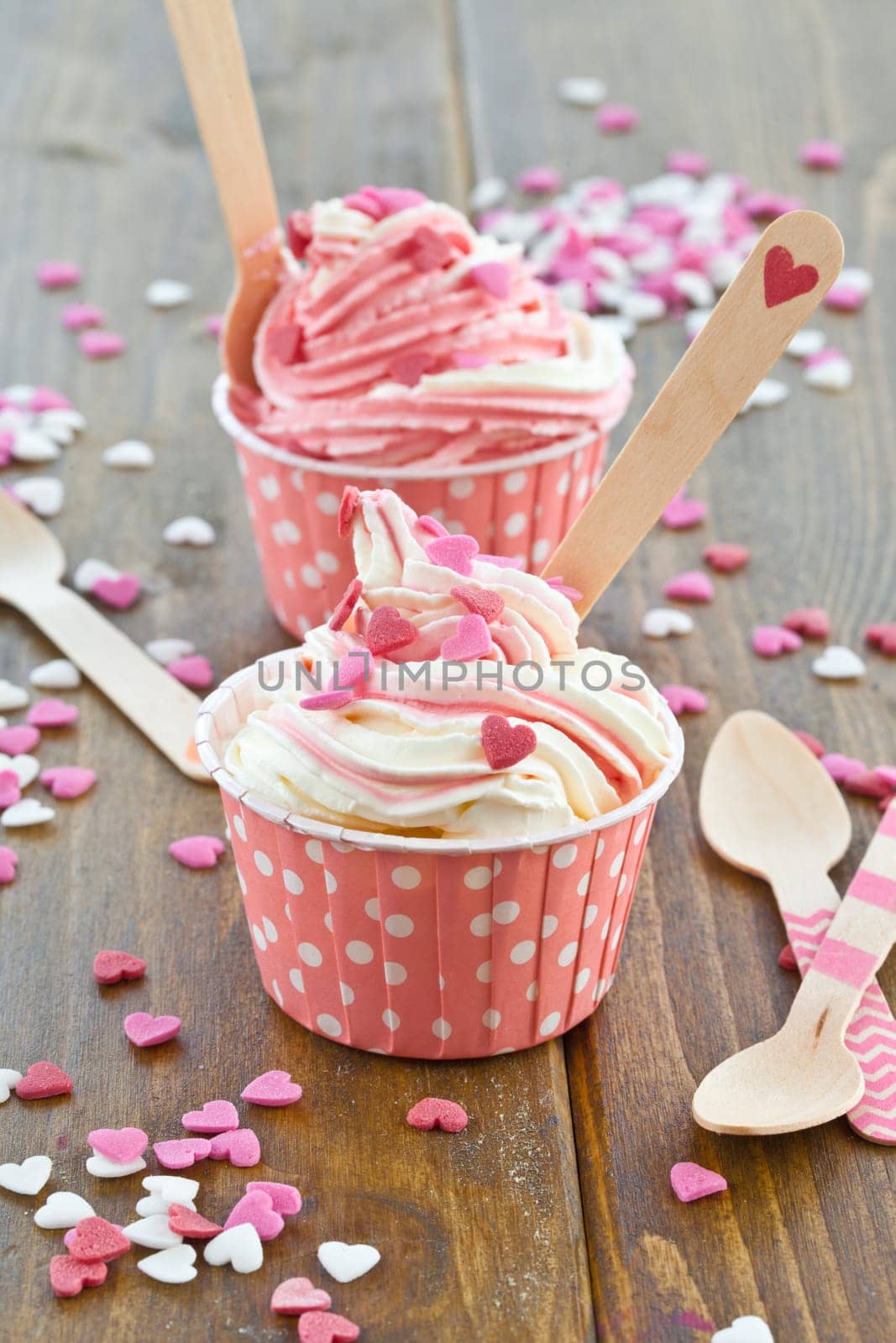Frozen yogurt with colorful hearts of sugar