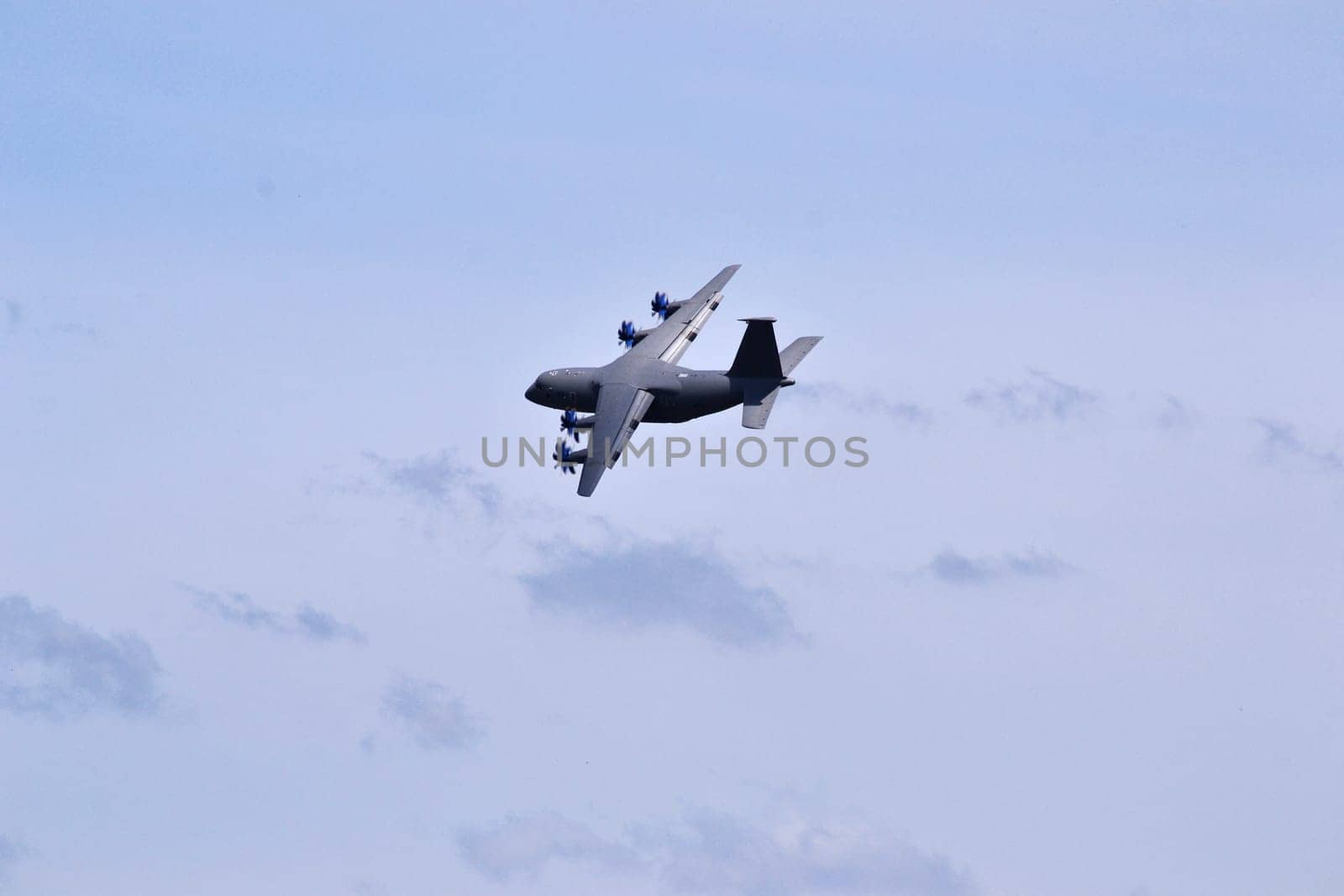 Gray plane high in the sky