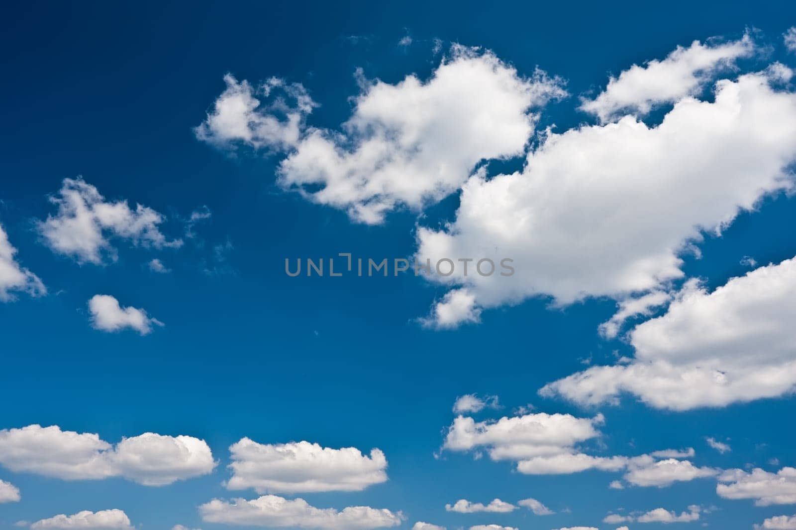 White clouds in blue summer sky background