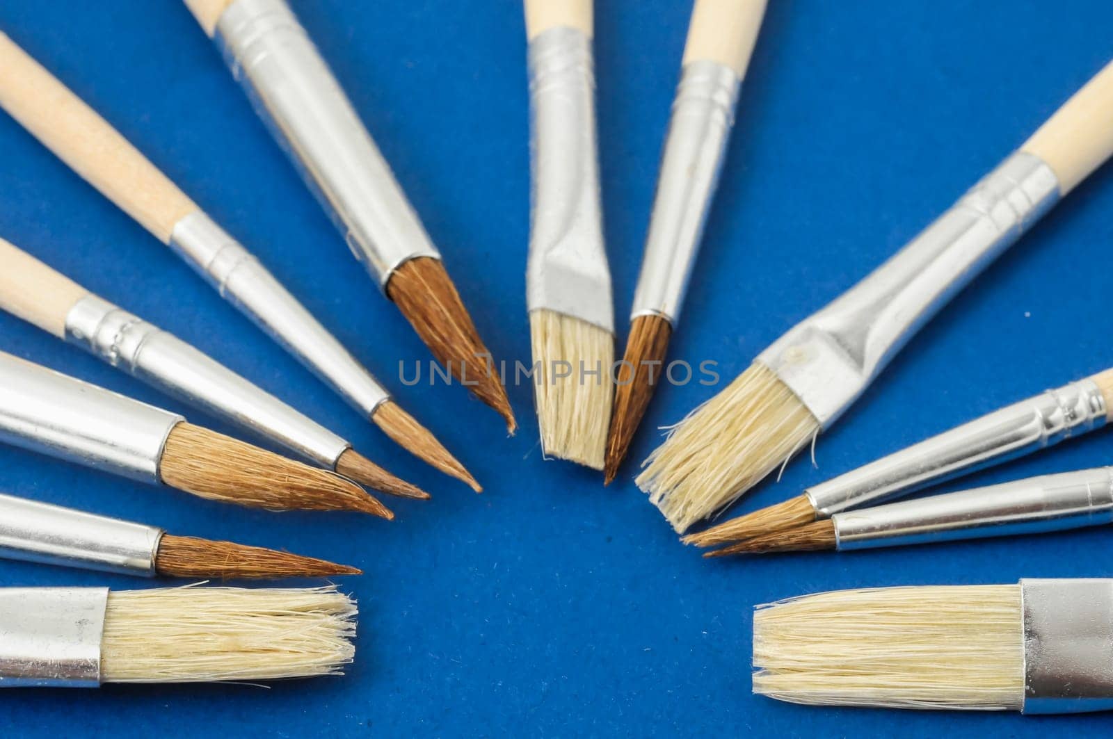 New Wooden Different Paintbrush Set Texture over a Colored Background