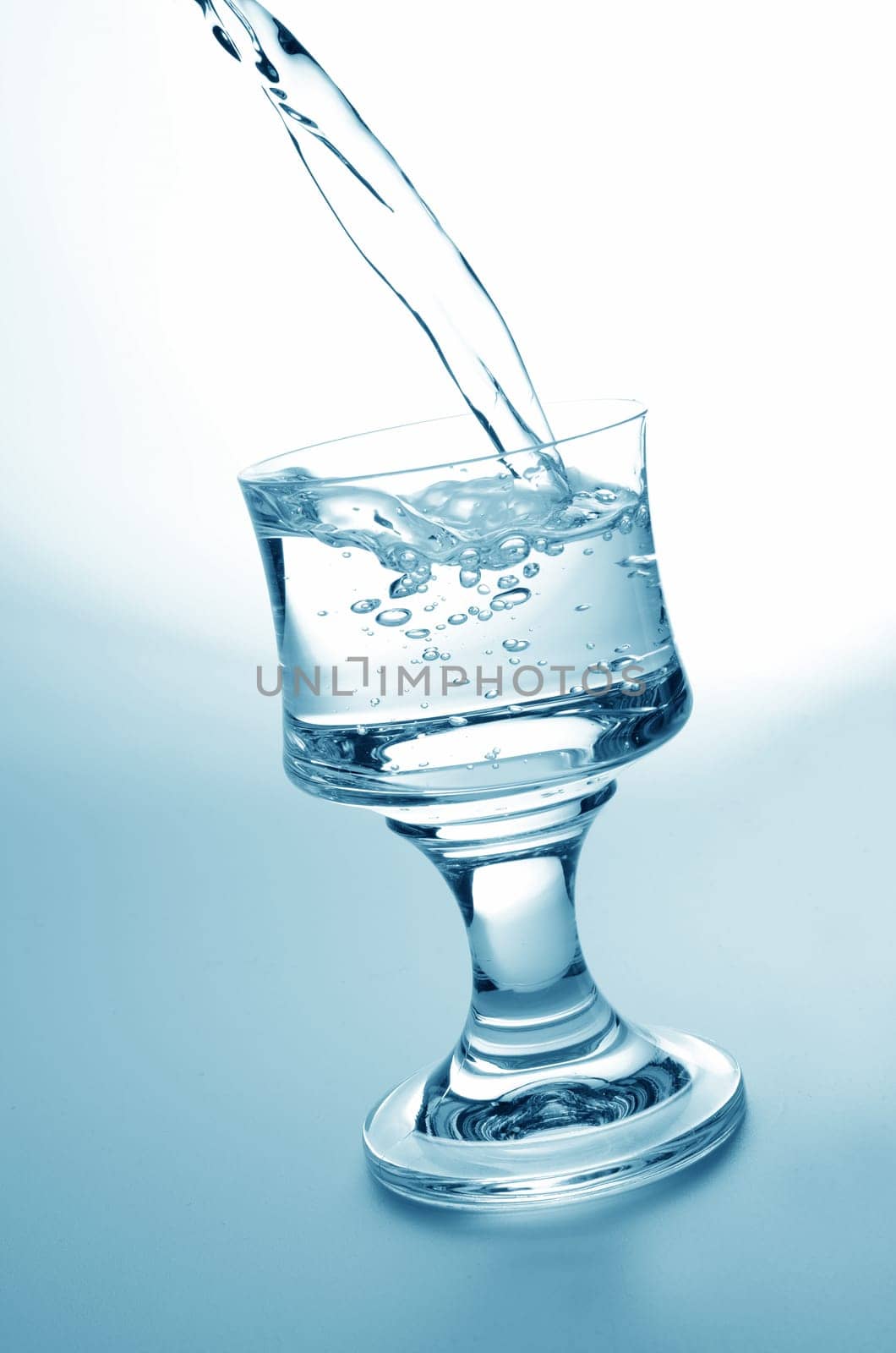 Pouring fresh water,healthy food and diet concept