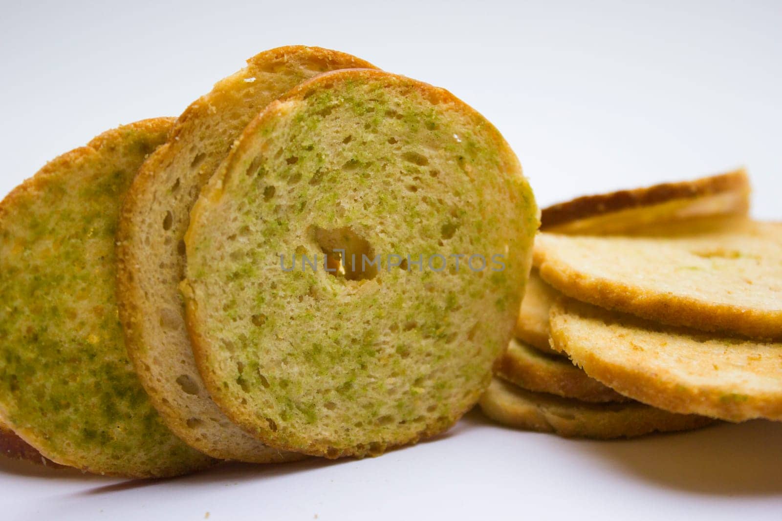 Healthy bruschettas baked with green herbs.
