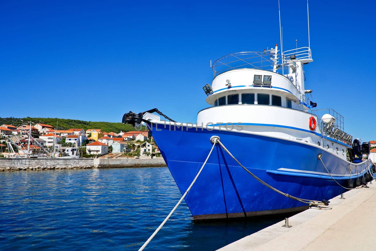 Blue fishing boat in the harbour