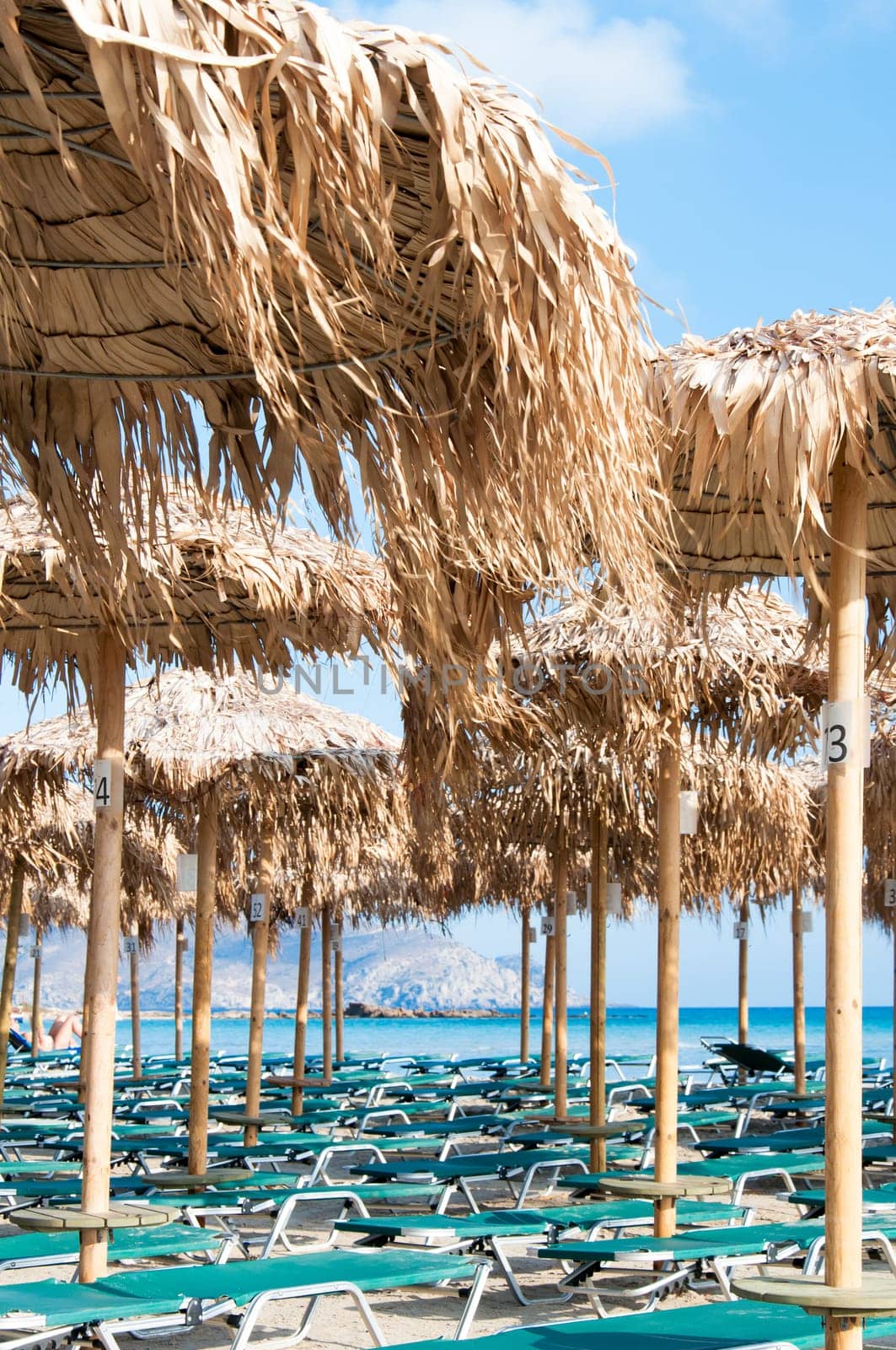 Umbrellas and sunbeds on Elafonissi beach, Crete,  Greece
