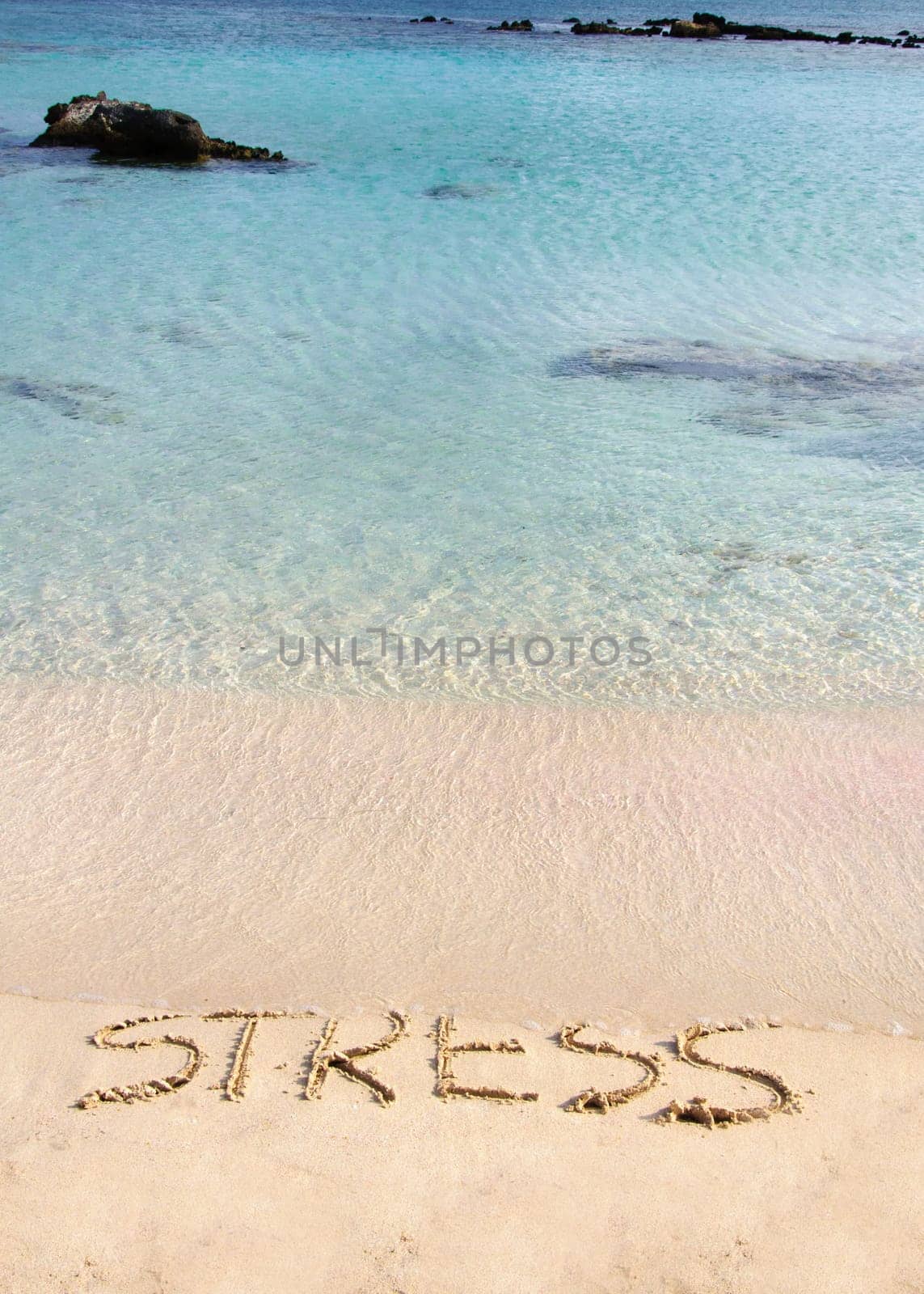 Word Stress written on sand, washed away by waves, relax concept