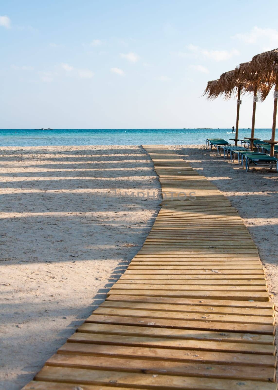 Umbrellas and sunbeds on Elafonissi beach, Crete,  Greece