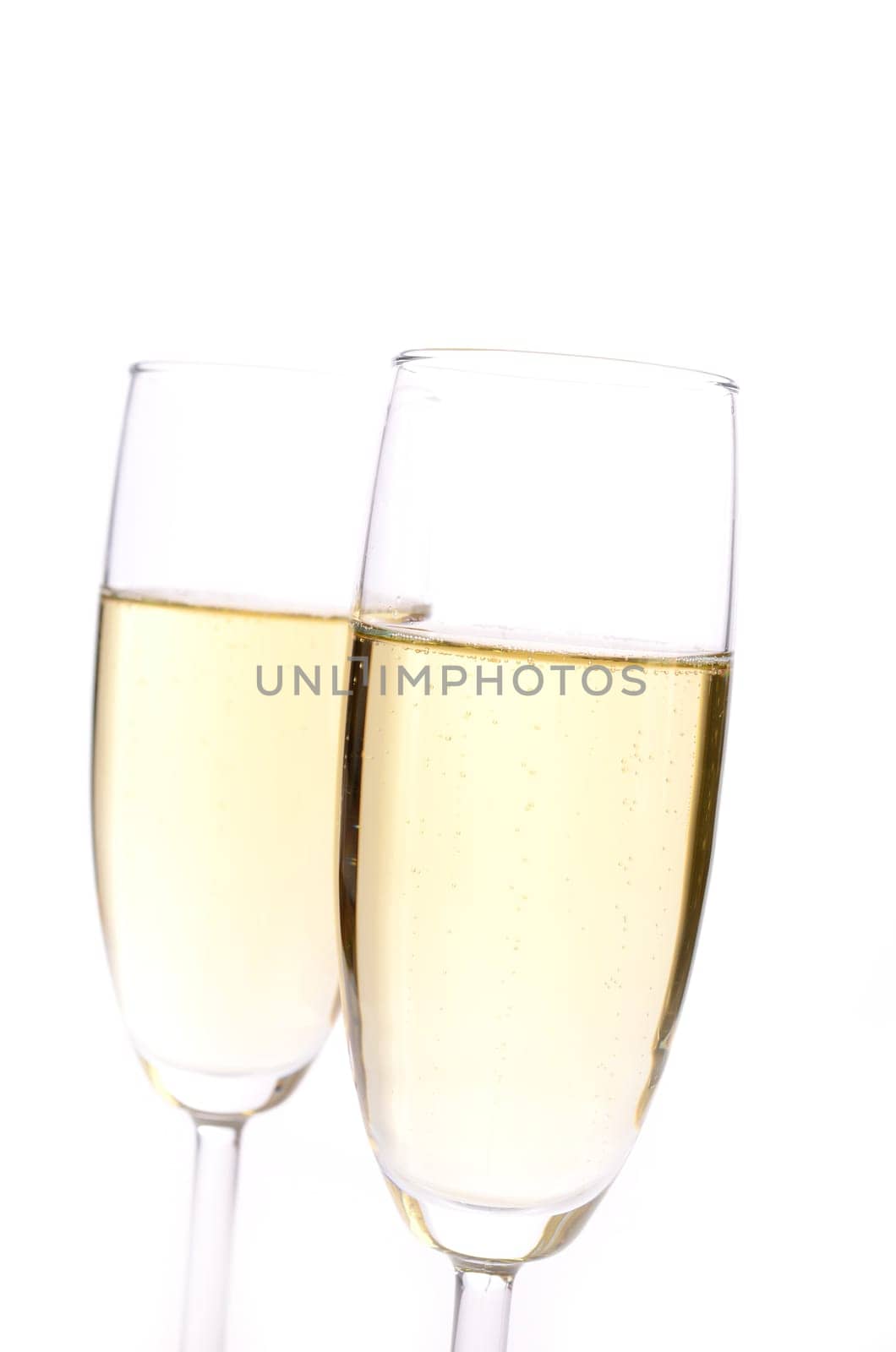 Two glasses of sparkling wine with a red bow