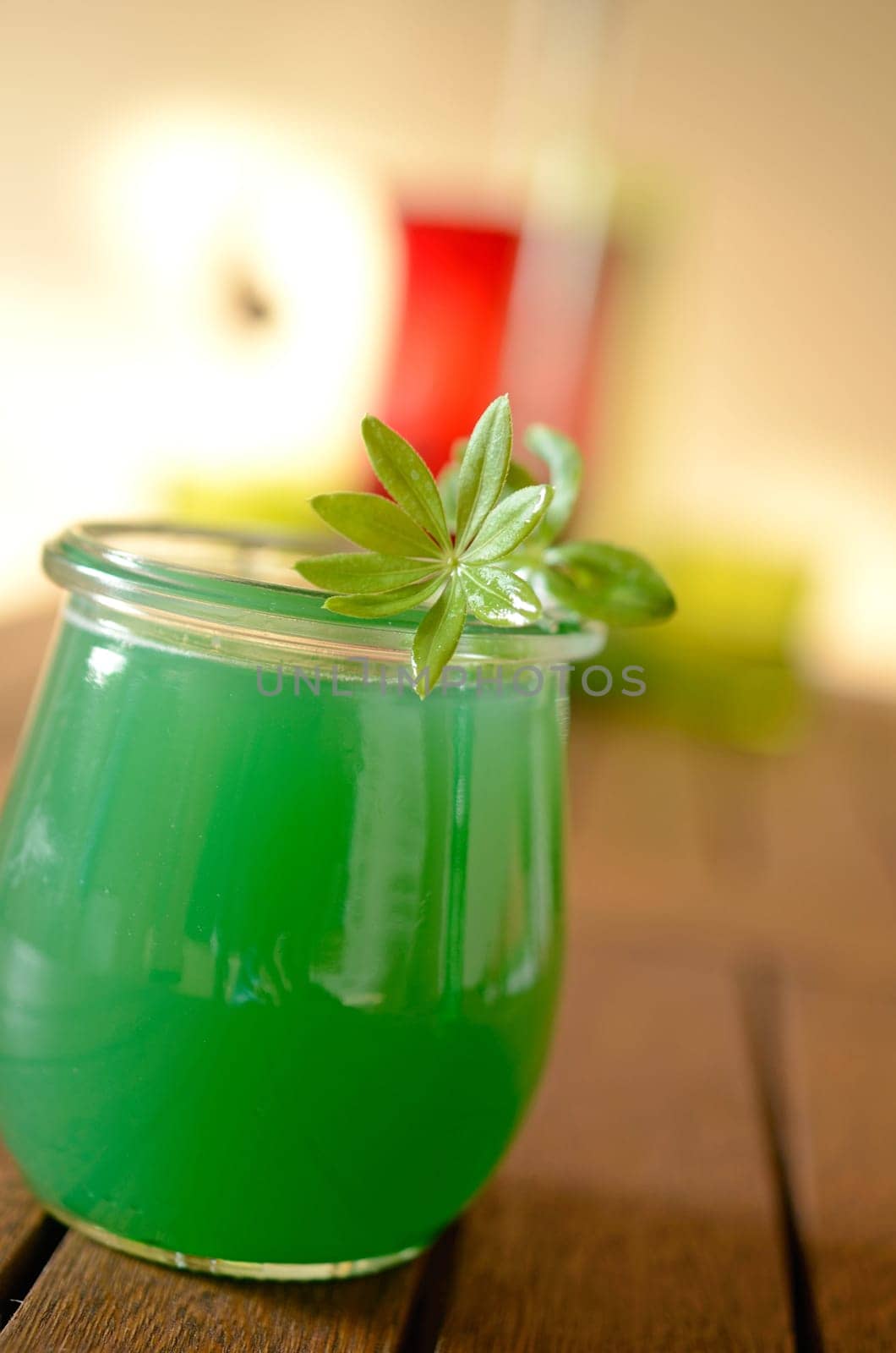 Woodruff liqueur on a wooden table