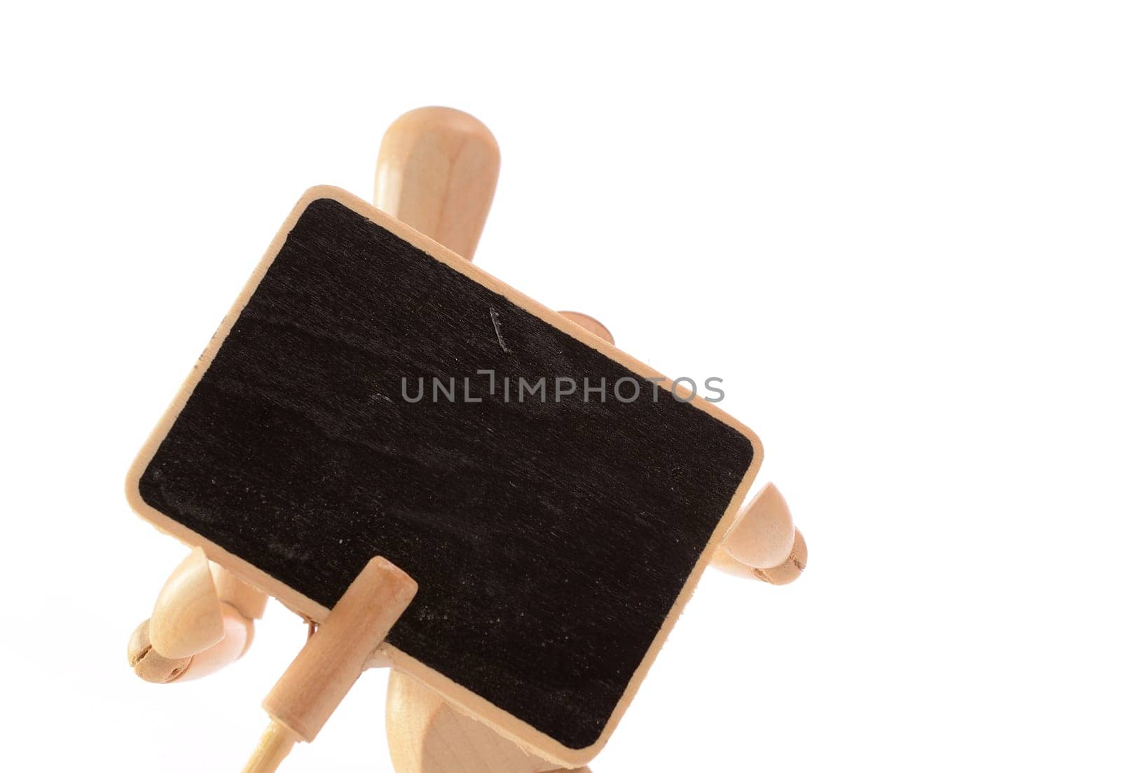 Wooden man holding a blackboard with space for text